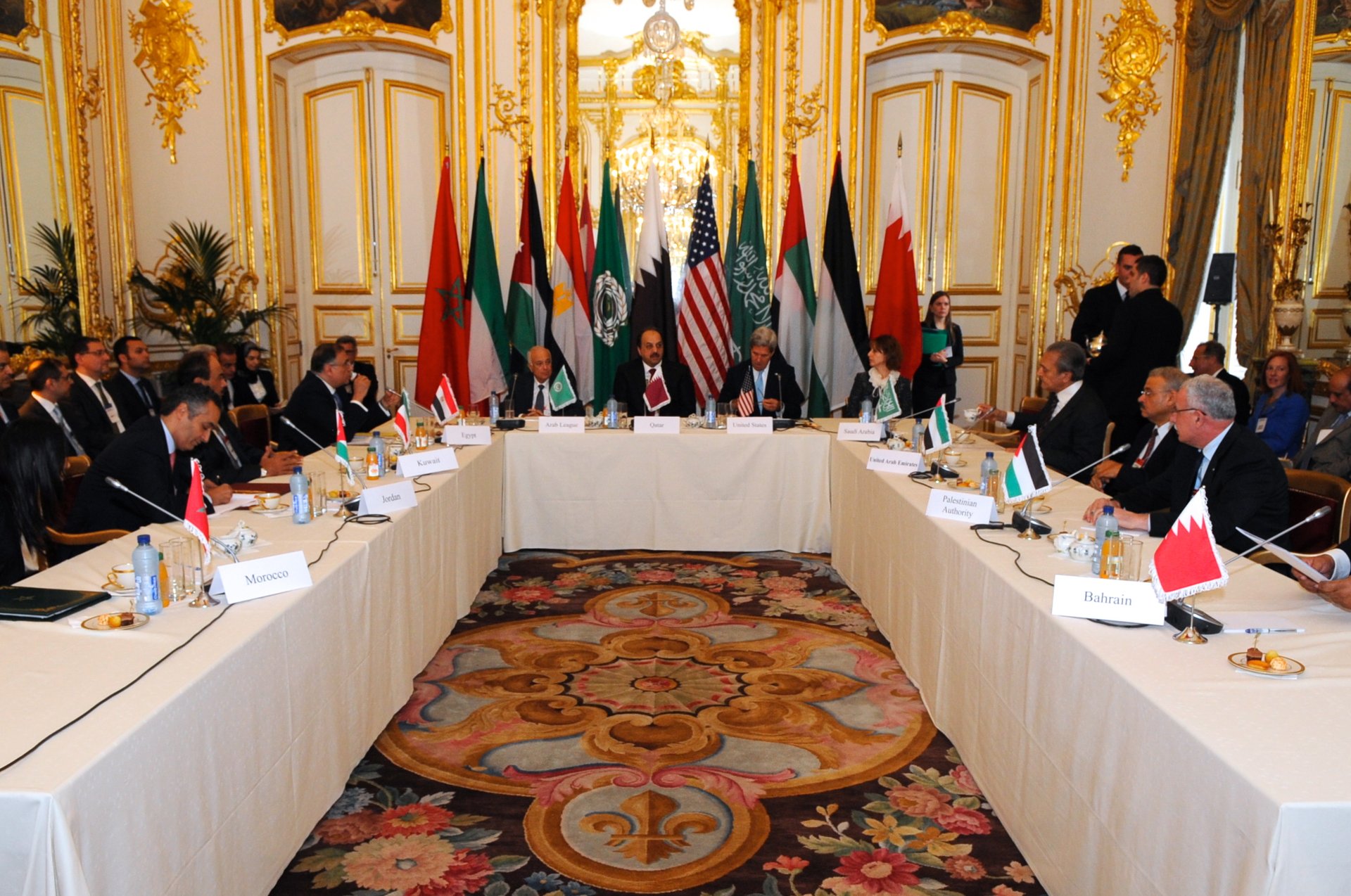 US Secretary of State John Kerry hosts Arab Peace Initiative meeting in Paris, October 2013, flanked by Arab League Secretary-General Nabil Alaraby and Qatari Foreign Minister Khalid al-Attiyah — the same 2002 framework Saudi Arabia continues to cite as its normalization baseline