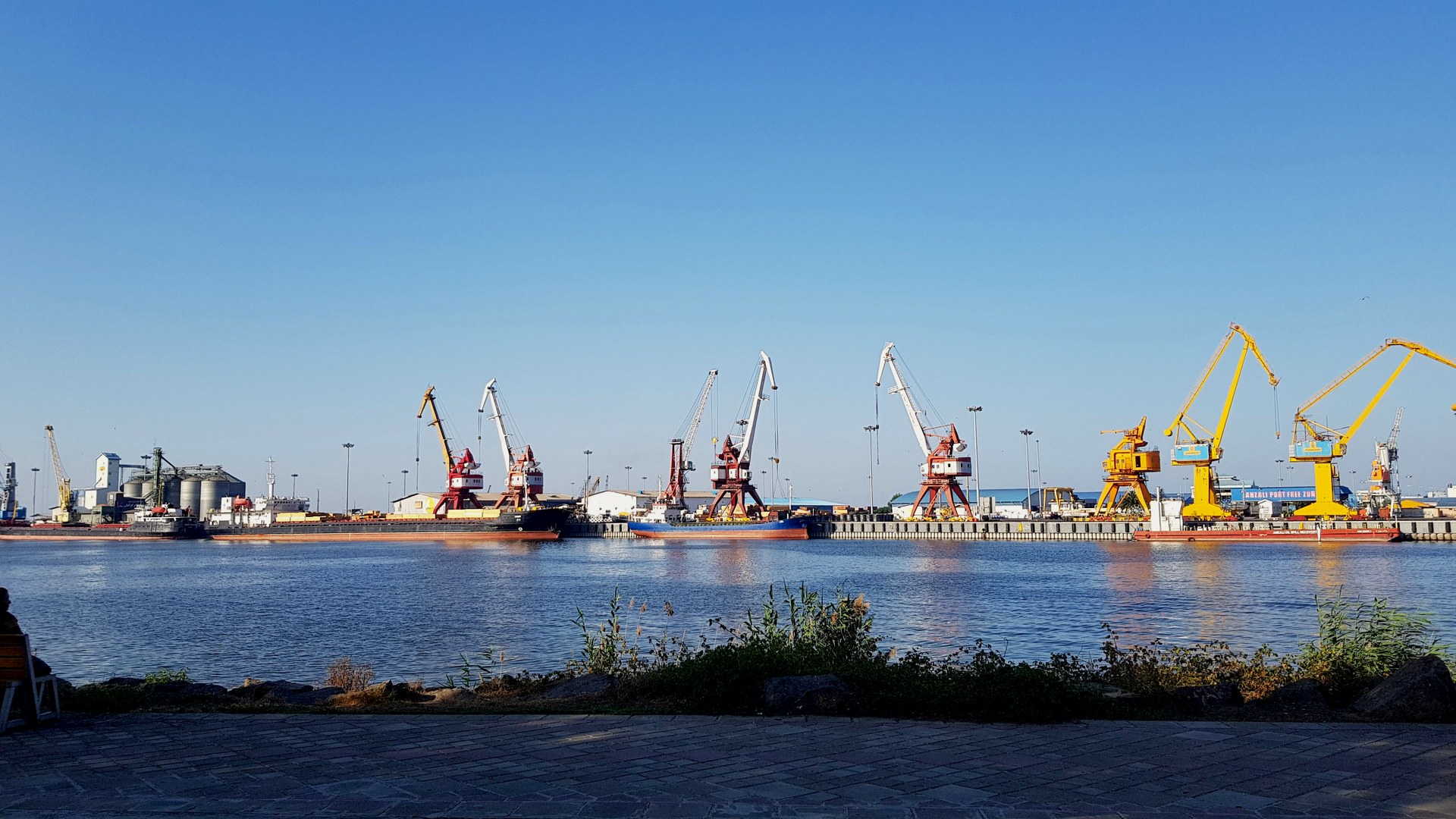Bandar-e Anzali port on Iran's Caspian coast showing commercial docks and cargo cranes, struck by Israeli airstrikes in March and April 2026