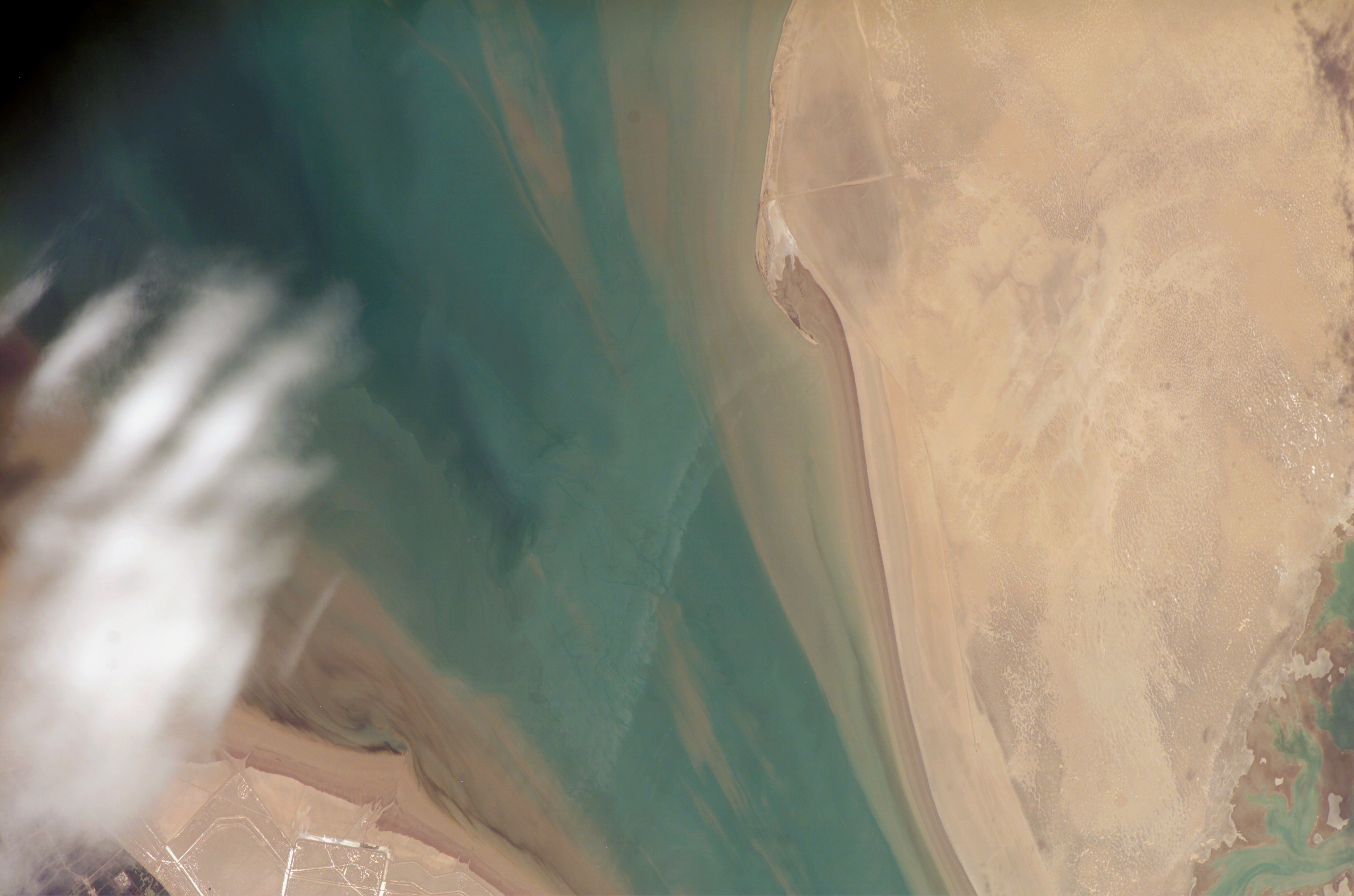 Bubiyan Island, Kuwait — ISS satellite view showing the sandy island at the northern tip of the Persian Gulf, separated from the mainland by the Khor Abdullah waterway