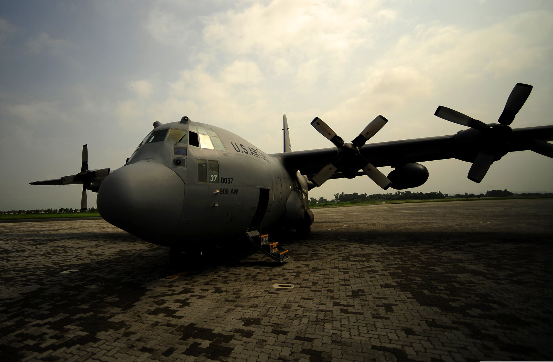 A C-130H Hercules aircraft on the flight line at PAF Base Chaklala (now Nur Khan) in Rawalpindi, Pakistan — the same base where US officials confirmed Iranian military aircraft including an RC-130 reconnaissance variant were sheltered during the April 2026 ceasefire
