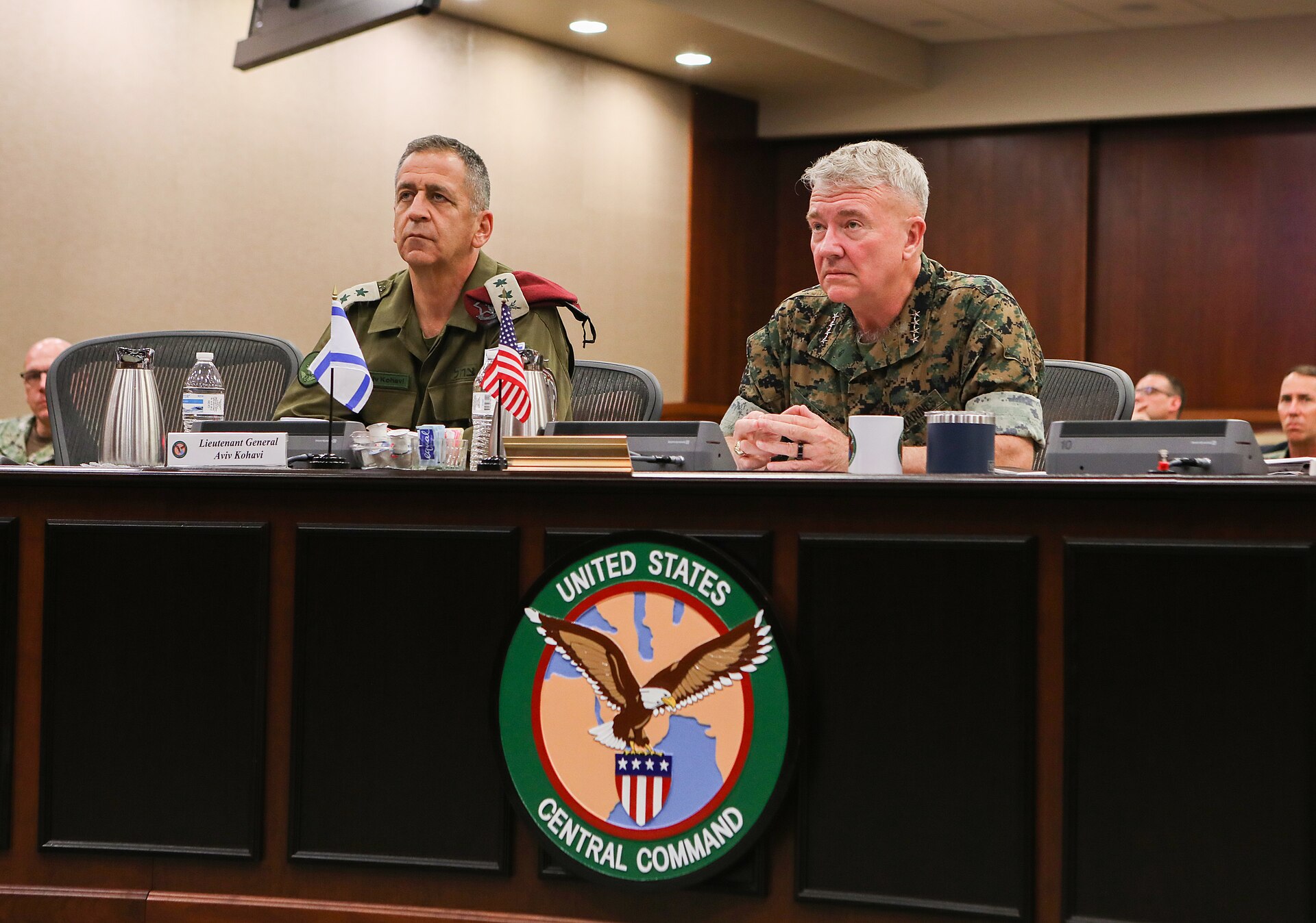 CENTCOM commander General McKenzie hosts a briefing at US Central Command headquarters with the CENTCOM seal prominent in the foreground
