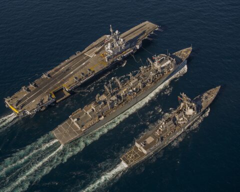 French aircraft carrier Charles de Gaulle (R91) conducting underway replenishment with USS Bulkeley and USNS Arctic in the Gulf of Oman, December 2013