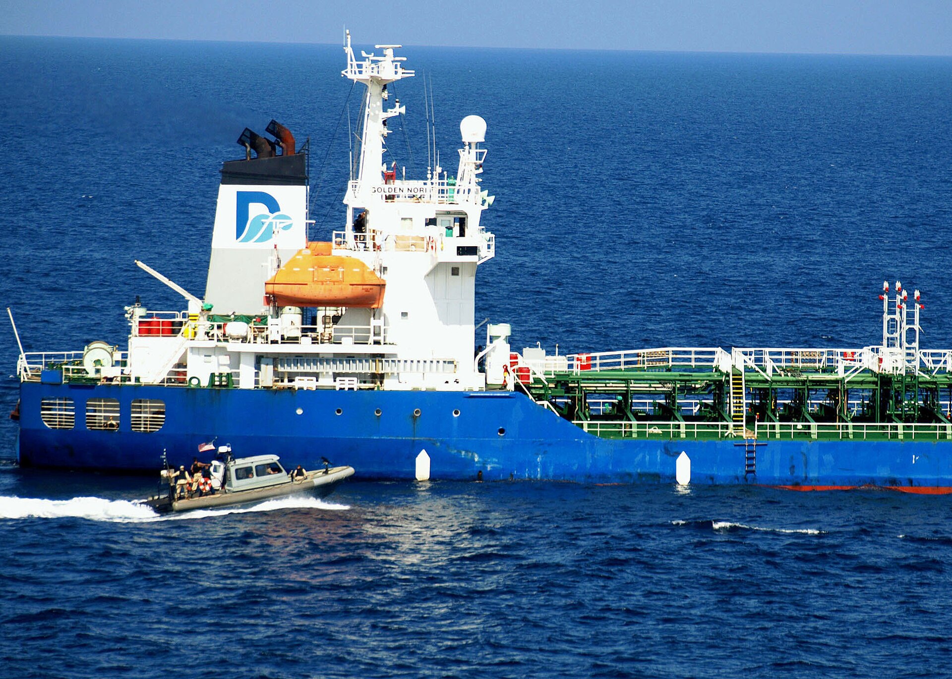 Japanese chemical tanker Golden Nori approached by a small boat in Gulf of Aden waters after pirate seizure December 2007, illustrating commercial vessel vulnerability to maritime interception