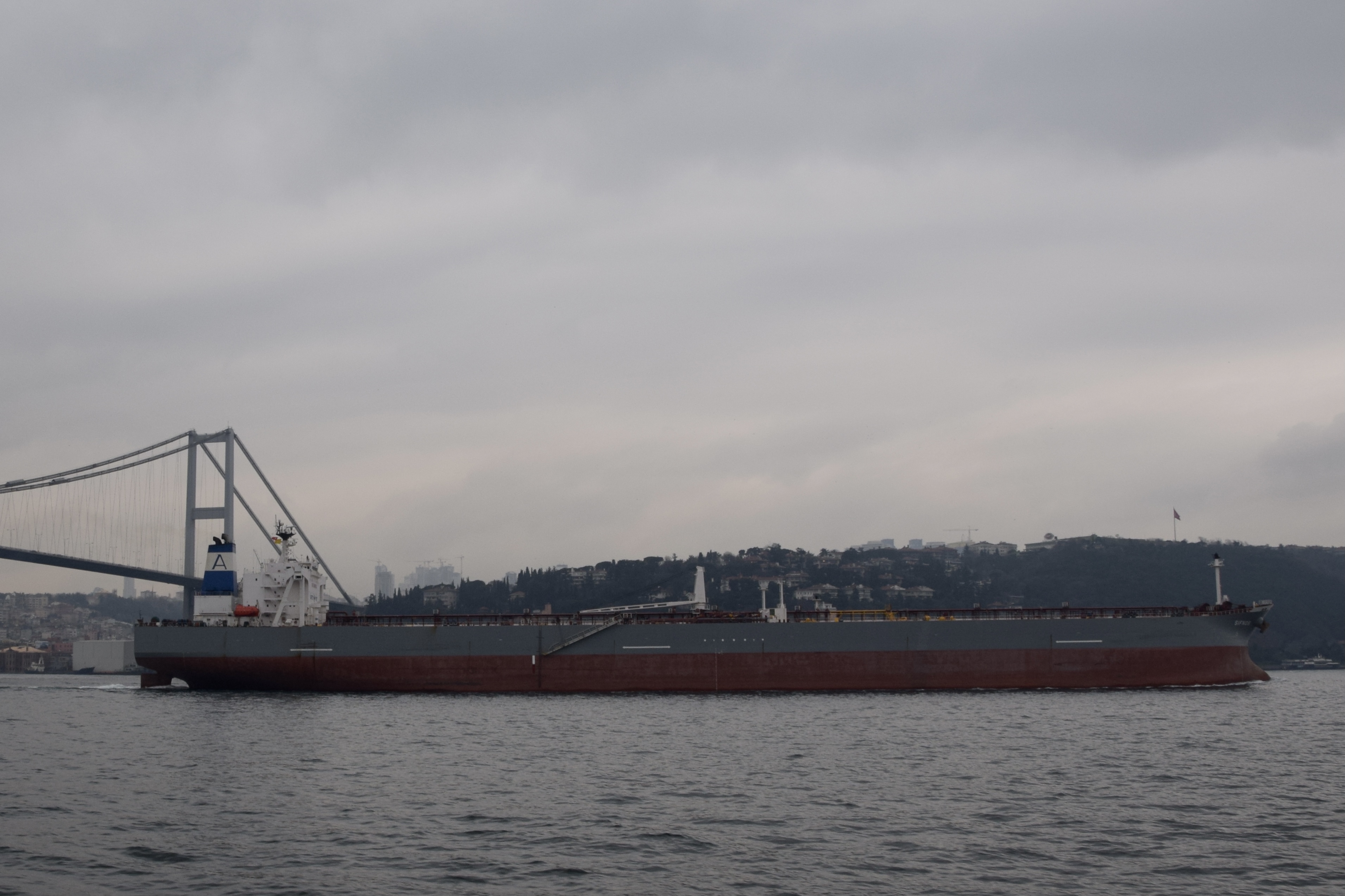 Crude oil tanker transiting a maritime strait — the type of vessel subject to PGSA toll compliance at Hormuz