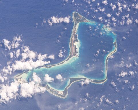 NASA satellite view of Diego Garcia atoll in the British Indian Ocean Territory — Iran launched Khorramshahr-4 ballistic missiles at the base in March 2026, establishing range and triggering a Pentagon combat zone designation