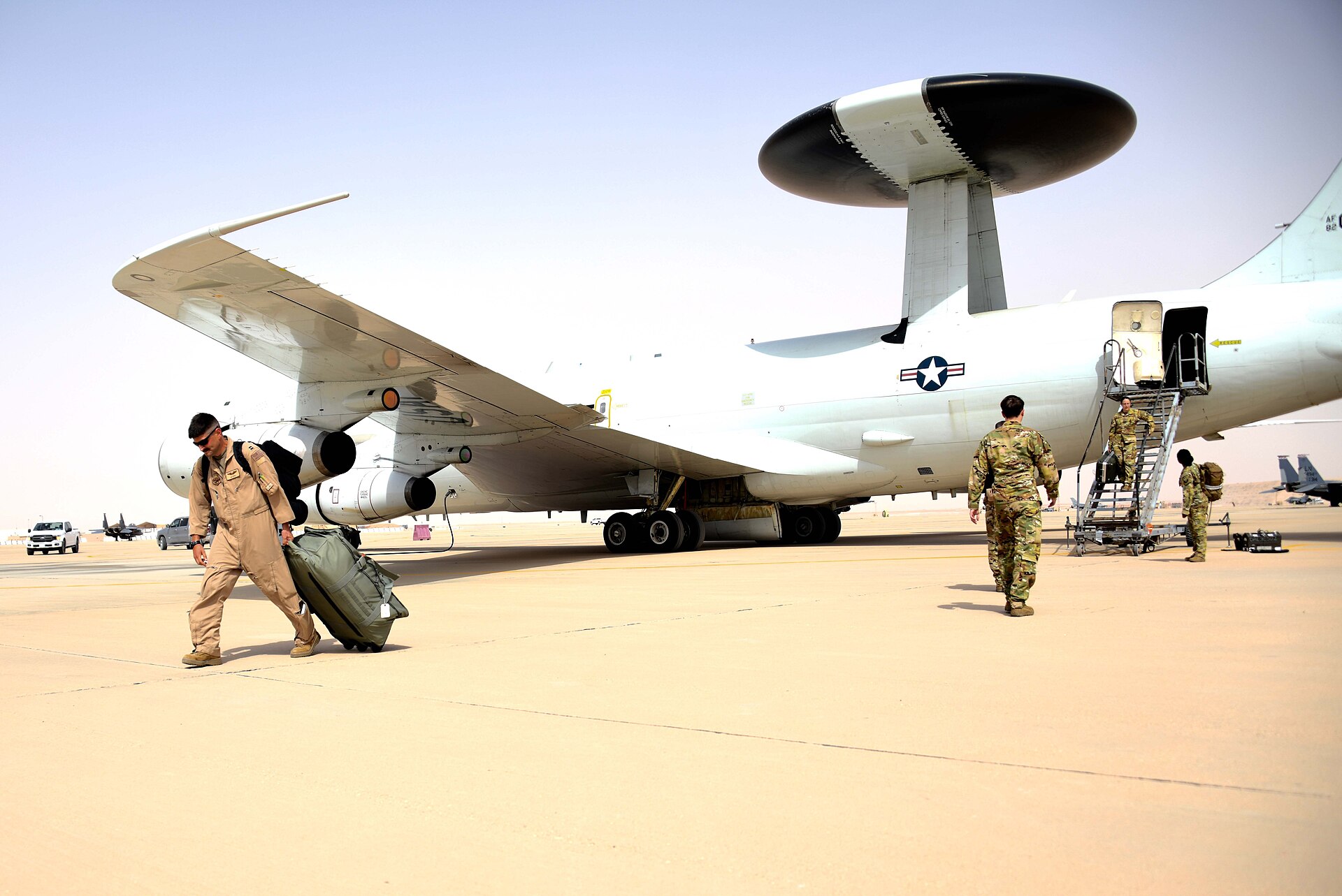 E-3G Sentry AWACS aircrew disembark at Prince Sultan Air Base, Saudi Arabia — the same aircraft type Iran destroyed on March 27, 2026 in a strike that eliminated one of 16 US AWACS platforms