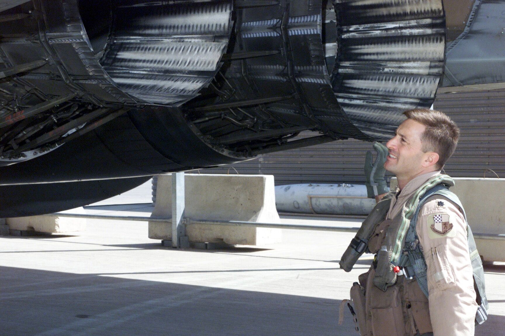 US Air Force pilot of the 363rd Fighter Squadron performs a pre-flight inspection of an F-15 Eagle at Prince Sultan Air Base, Saudi Arabia, during Operation SOUTHERN WATCH