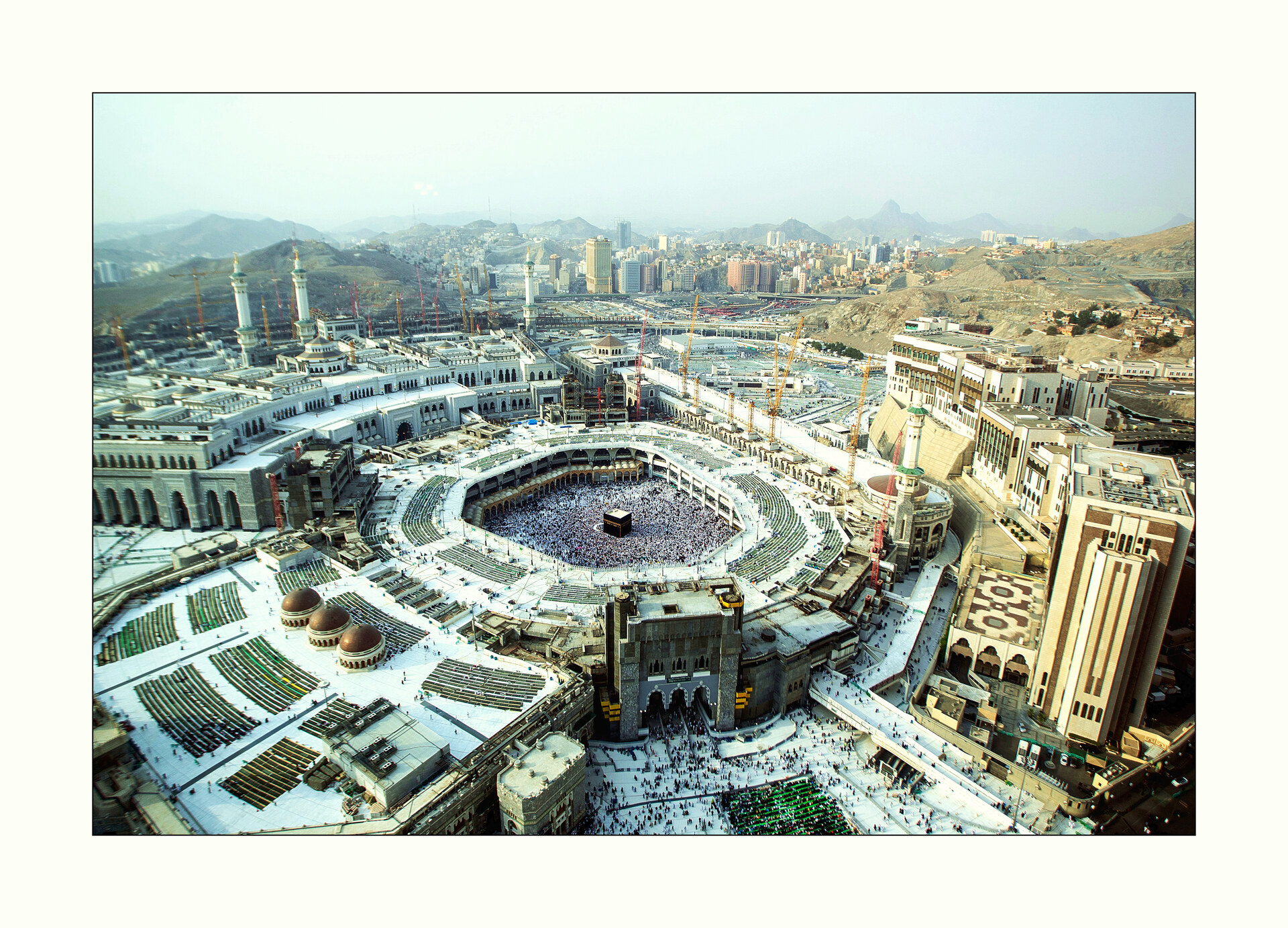 Aerial view of the Masjid al-Haram in Mecca, showing pilgrims circling the Kaaba at the centre of the Grand Mosque complex during Hajj season