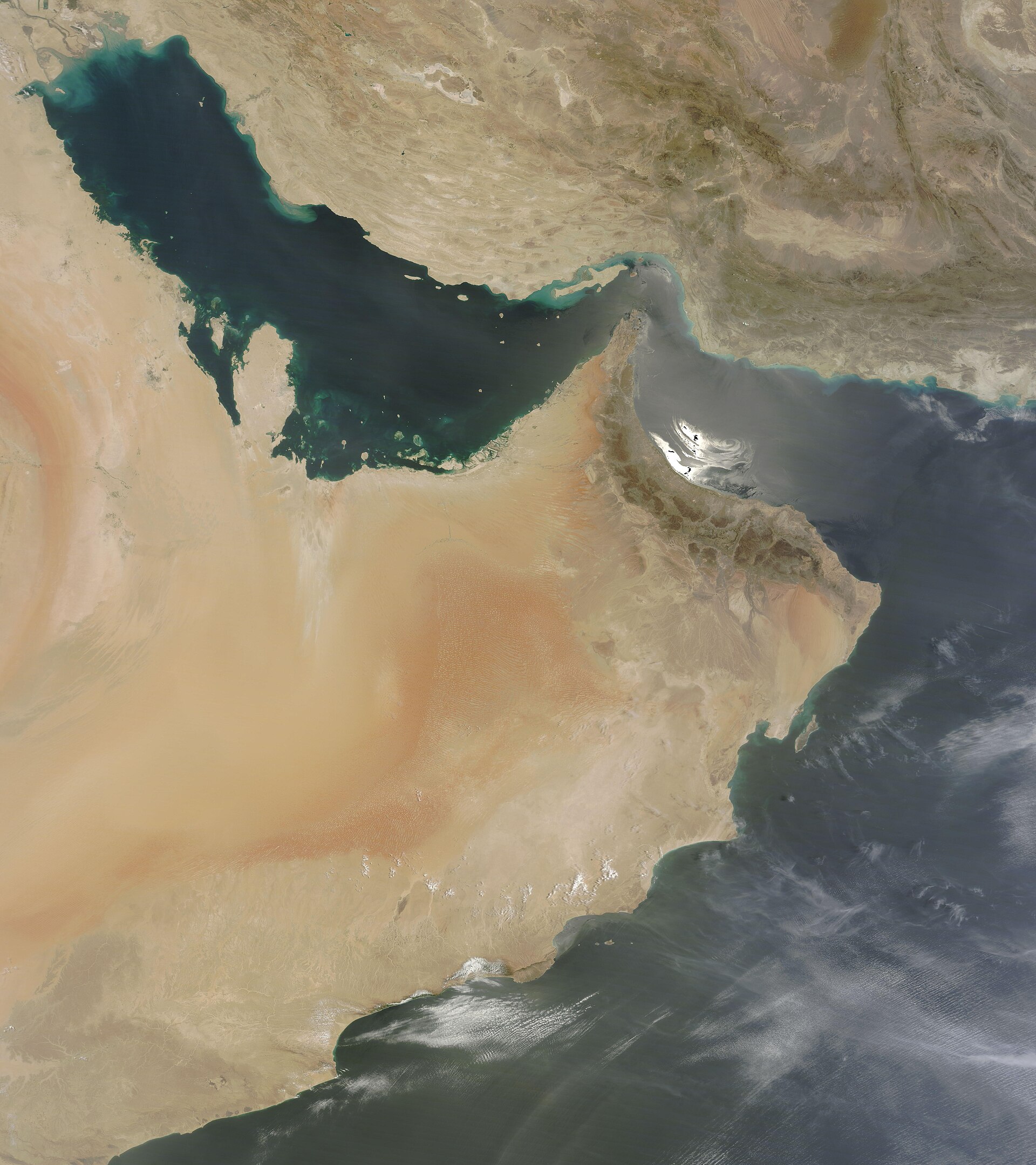 NASA MODIS satellite image showing the Gulf of Oman, Strait of Hormuz, and Persian Gulf — the full geographic extent of the IRGC 500-kilometer operational crescent from Jask to Siri Island