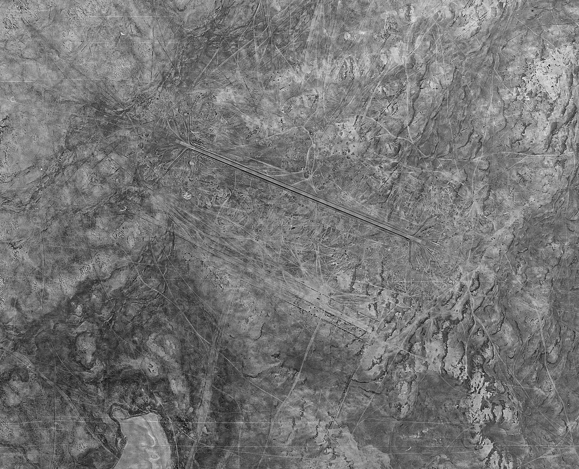 Declassified US intelligence satellite image of H-3 Air Base in western Iraq (Anbar province), July 1978, showing runways and desert terrain. H-3 is approximately 240 kilometres from the Syrian border and lies within the corridor Israeli aircraft have used to bypass Saudi airspace.