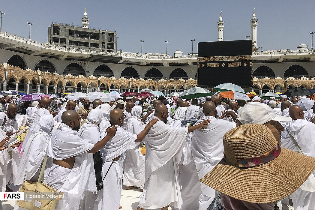 Hajj pilgrims in white ihram perform tawaf around the Kaaba at the Masjid al-Haram in Mecca