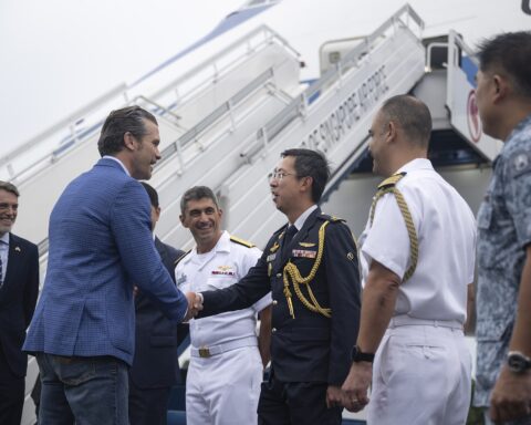 US Secretary of Defense Pete Hegseth arrives in Singapore for the Shangri-La Dialogue, greeted by Singapore Air Force Brigadier General Simon Lee, May 30, 2025