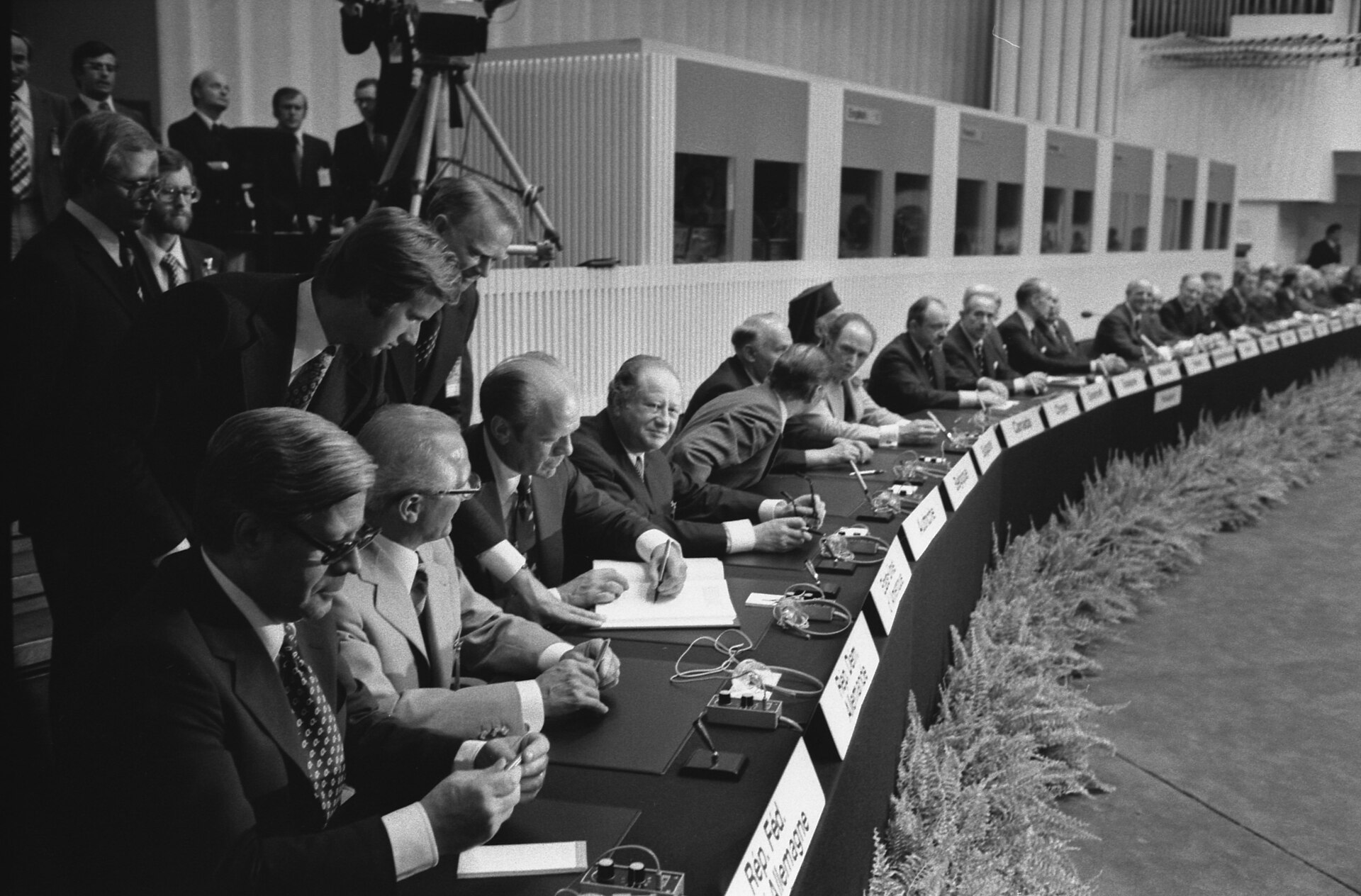 Leaders of 35 nations sign the Helsinki Final Act at Finlandia Hall, August 1, 1975 — including Gerald Ford, Leonid Brezhnev, and Helmut Schmidt at the long ceremonial table