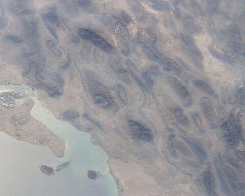ISS satellite view of Qeshm Island, Larak Island, and the Strait of Hormuz — the geographic setting for Iran’s PGSA transit authority. Photo: NASA/JSC Earth Science Unit, Public Domain