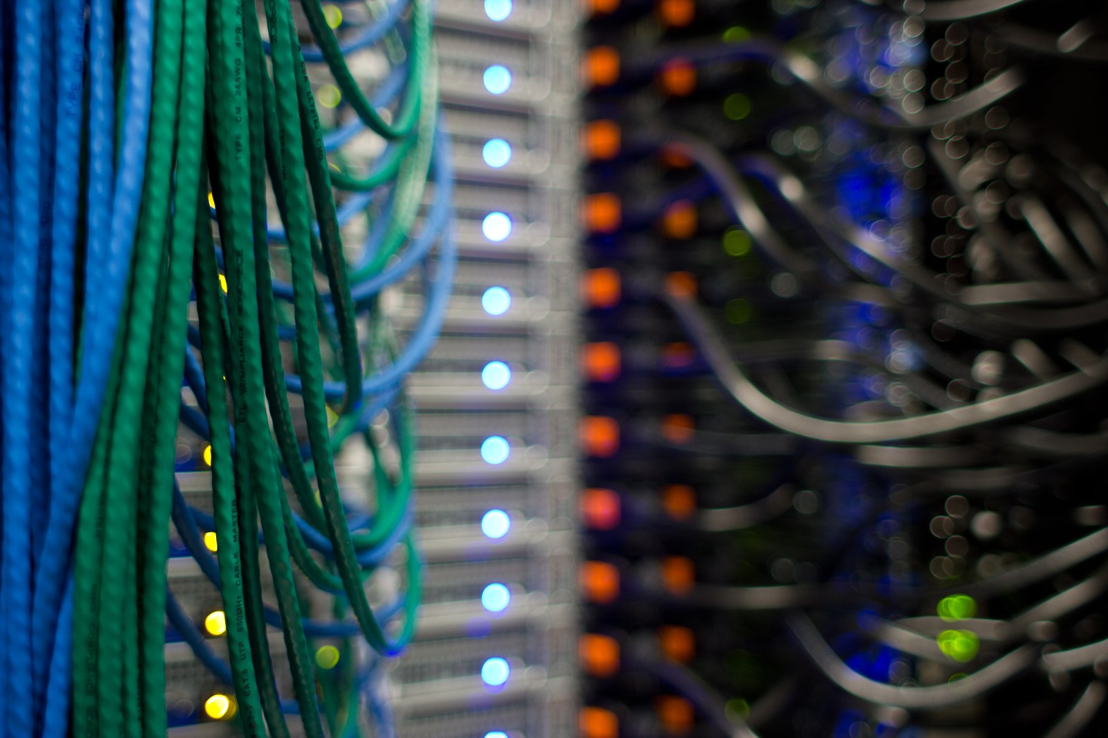 Fibre optic cables and server rack indicators inside a data centre — the infrastructure architecture HUMAIN is deploying across Saudi Arabia