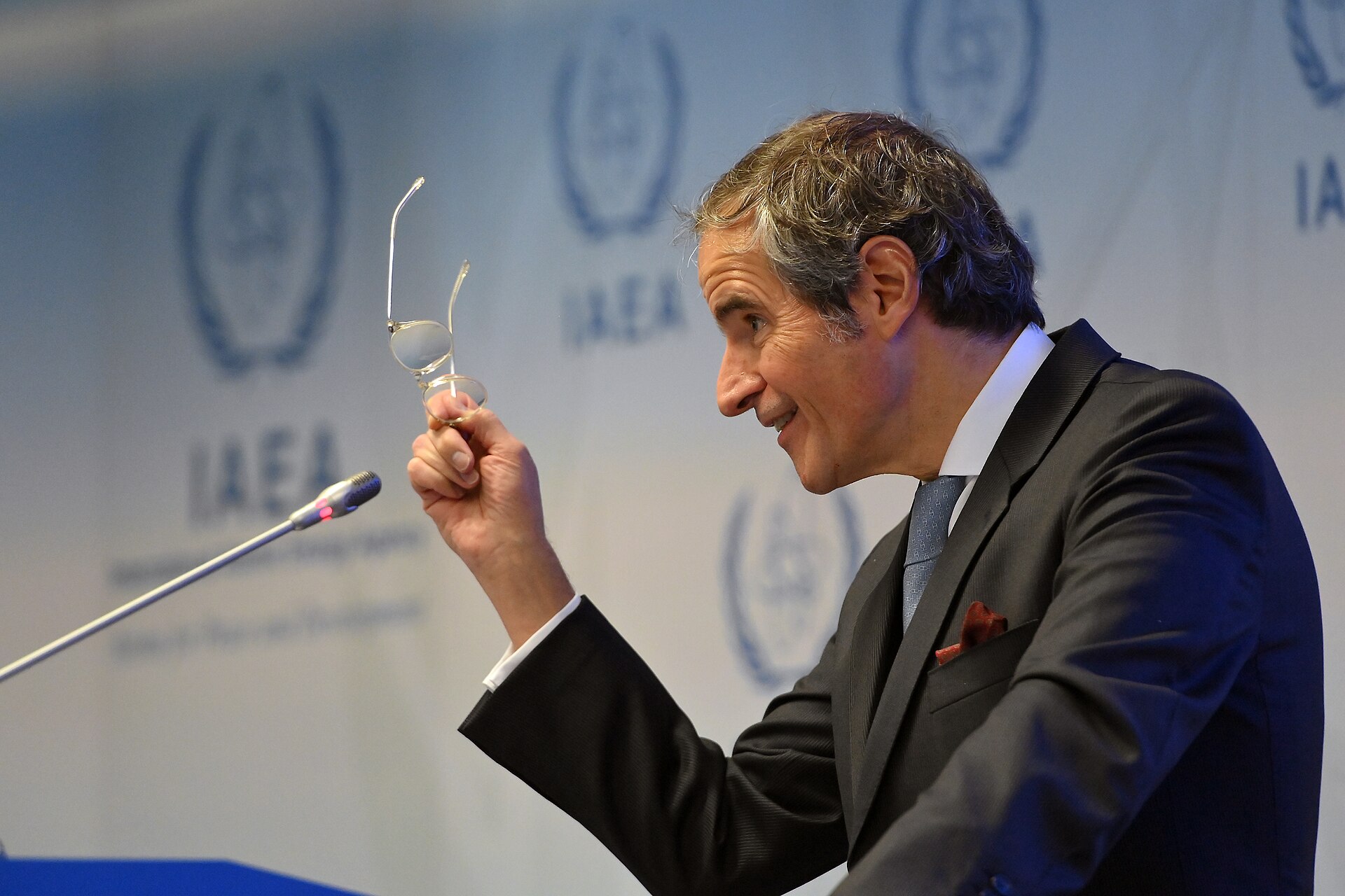 IAEA Director General Rafael Grossi at a press briefing with IAEA logos displayed behind him, speaking on Iran nuclear programme verification