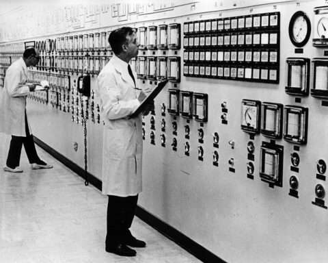 IAEA safeguards inspectors monitoring nuclear reactor facility control room — historical IAEA verification mission