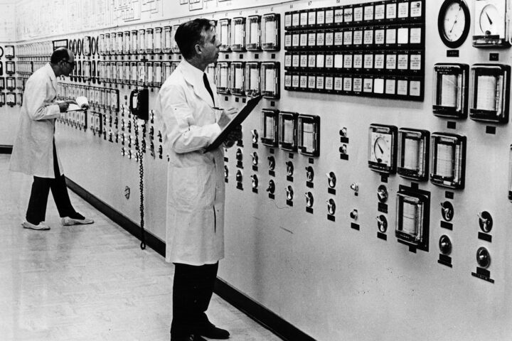 IAEA safeguards inspectors monitoring nuclear reactor facility control room — historical IAEA verification mission