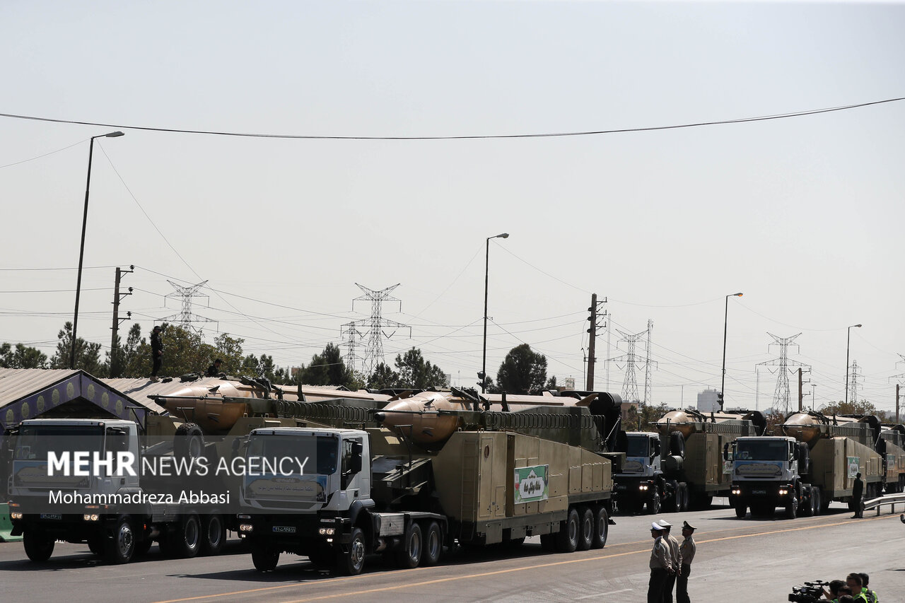 Iranian Emad medium-range ballistic missiles mounted on transport-erector-launcher vehicles during Sacred Defence Week parade in Tehran, September 2023