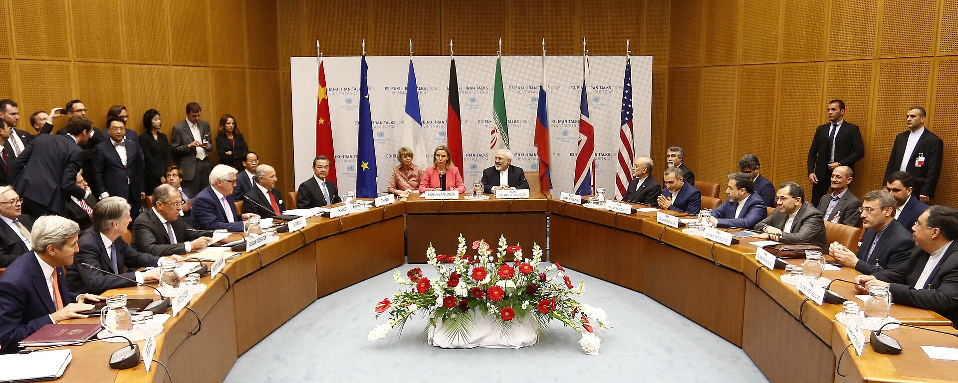 US and Iranian negotiators at the Iran nuclear talks table in Vienna, July 2015, with P5+1 flags visible