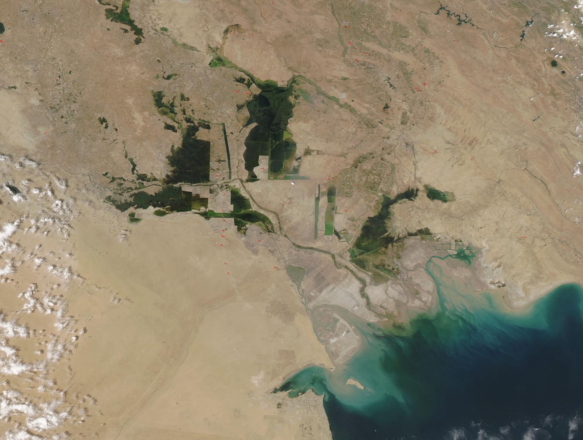 NASA MODIS satellite image showing Iraq, Iran, and Kuwait with the northern Persian Gulf — the geographic corridor from which Iran launched simultaneous drone strikes against Kuwait, the UAE, and Qatar on May 10, 2026