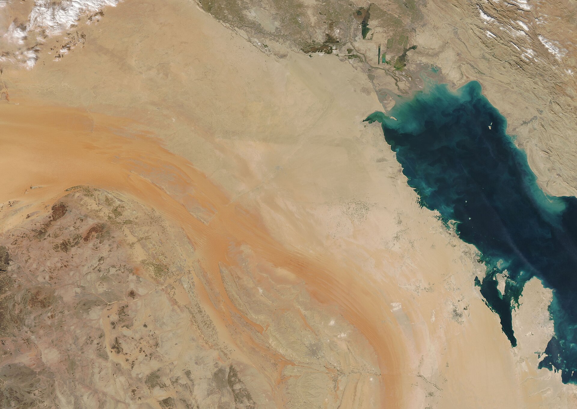 NASA Aqua MODIS satellite view of Saudi Arabia, Iraq, and Kuwait, showing the eastern Saudi desert and the Persian Gulf coastline that forms the eastern boundary of the PMF drone corridor