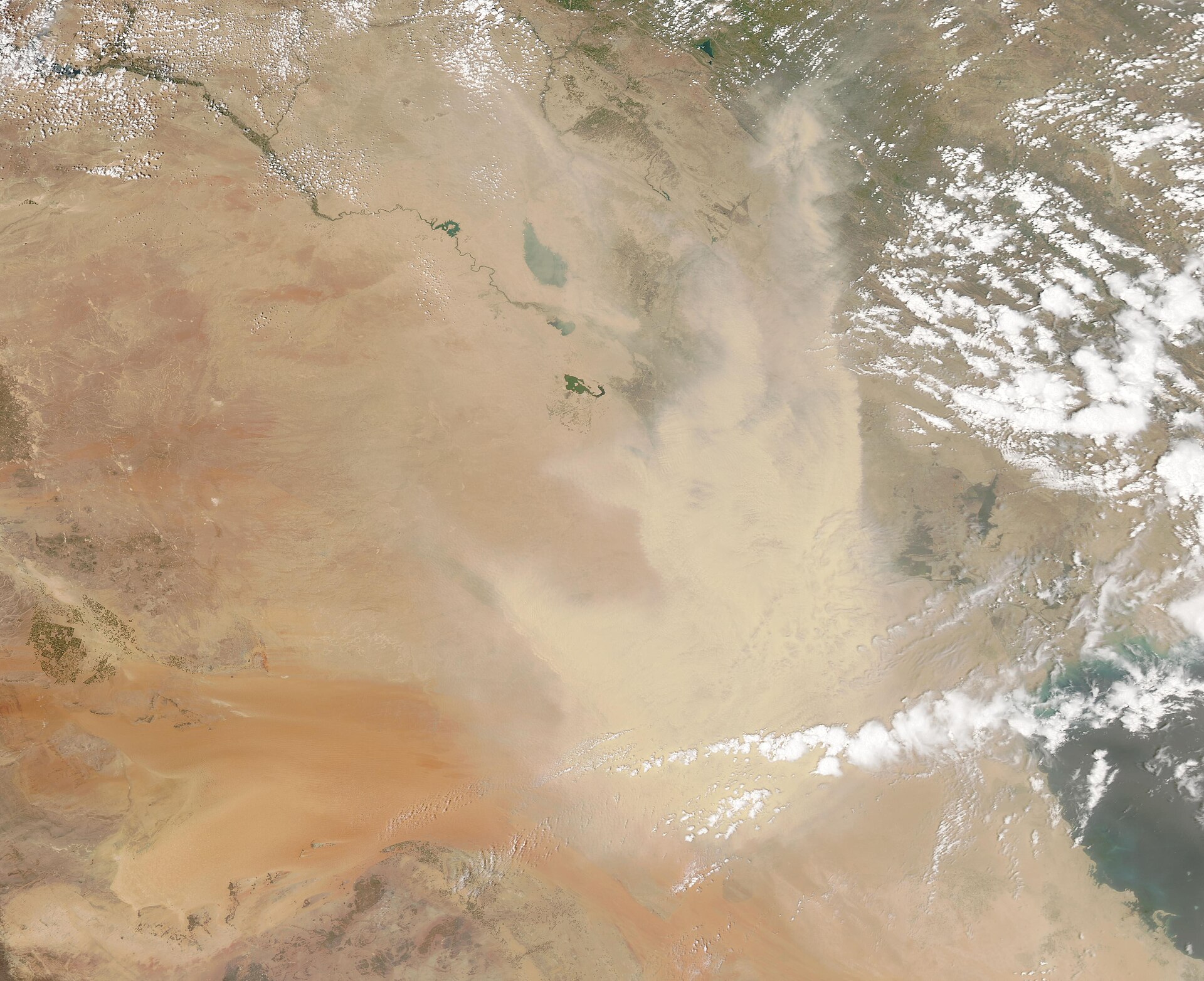 NASA MODIS satellite image of western Iraq and northern Saudi Arabia desert, showing the Anbar desert corridor terrain across which drones have been launched toward Saudi Arabia since February 2026