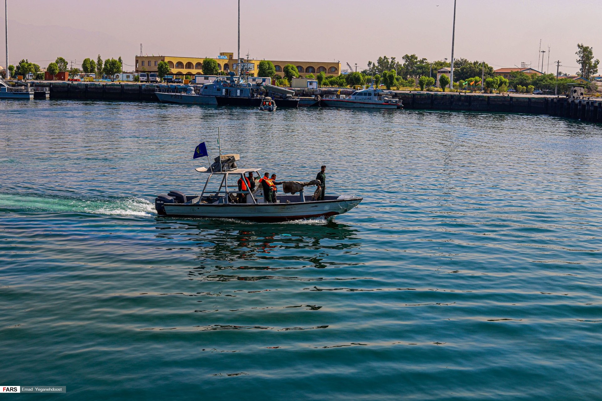 IRGC Navy speedboat underway at Bandar Abbas naval base during a commissioning ceremony adding 112 fast attack craft to the force that controls the Gulf of Oman exit of the Strait of Hormuz