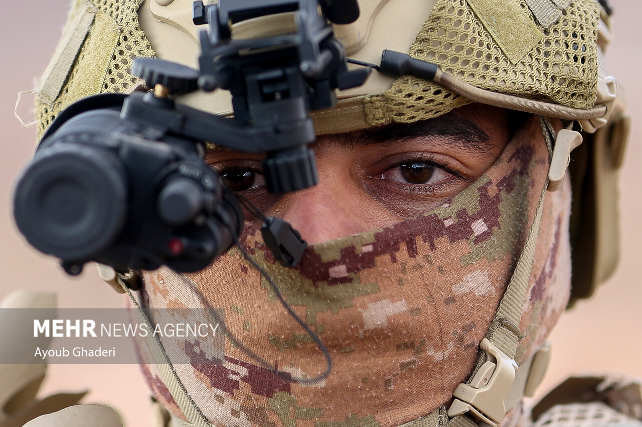 Islamic Revolutionary Guard Corps soldier with night-vision equipment at tactical exercise, Kerman province, Iran