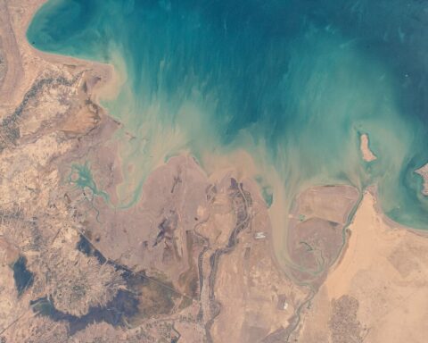 Kuwait northern coast and Persian Gulf viewed from International Space Station, showing the Bubiyan and Warbah island area at the head of the Gulf where the Khor Abdullah waterway enters from Iraq