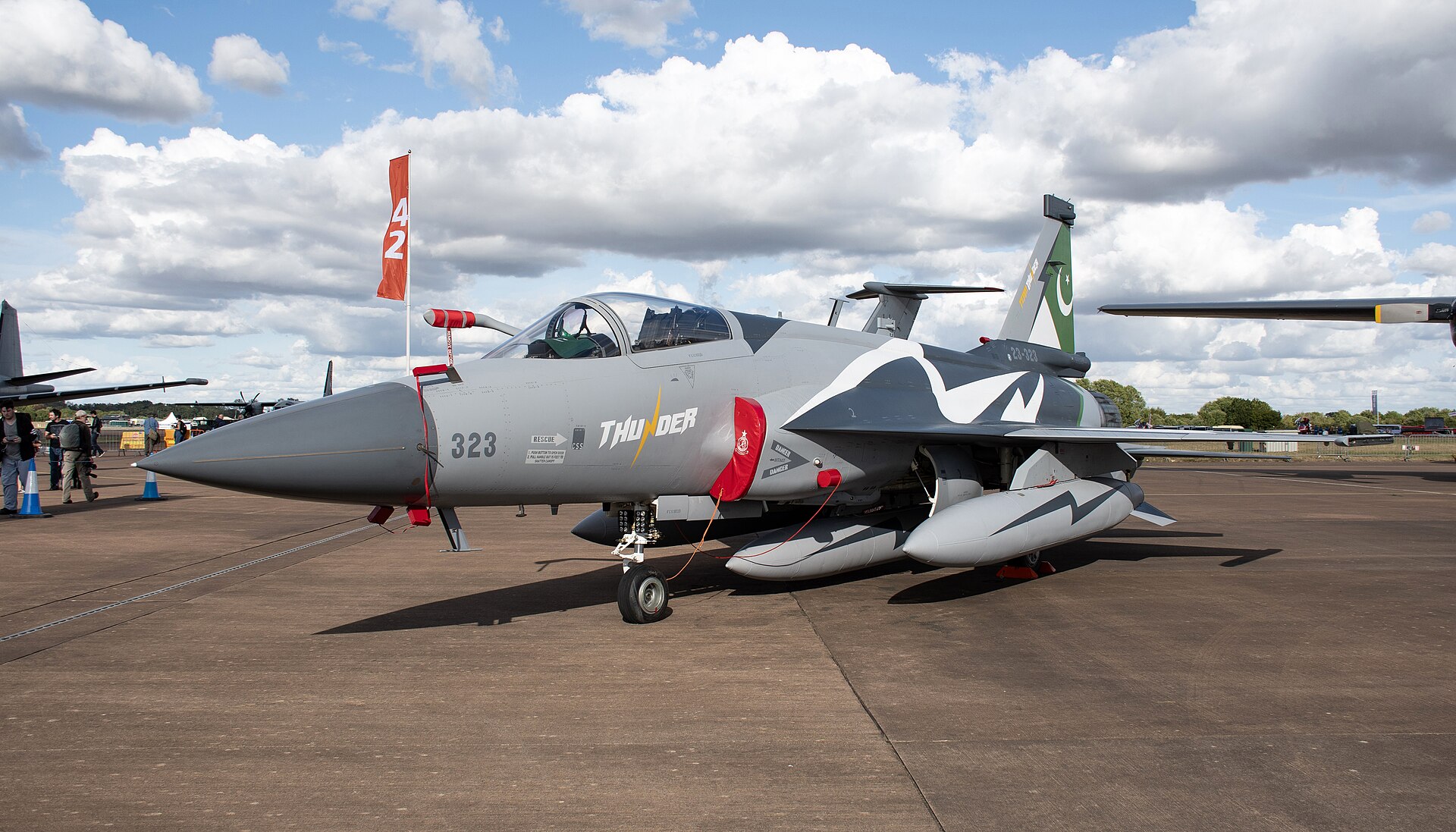 JF-17 Block III Thunder Pakistan Air Force multirole fighter jet on tarmac, crescent and star Pakistan flag on tail