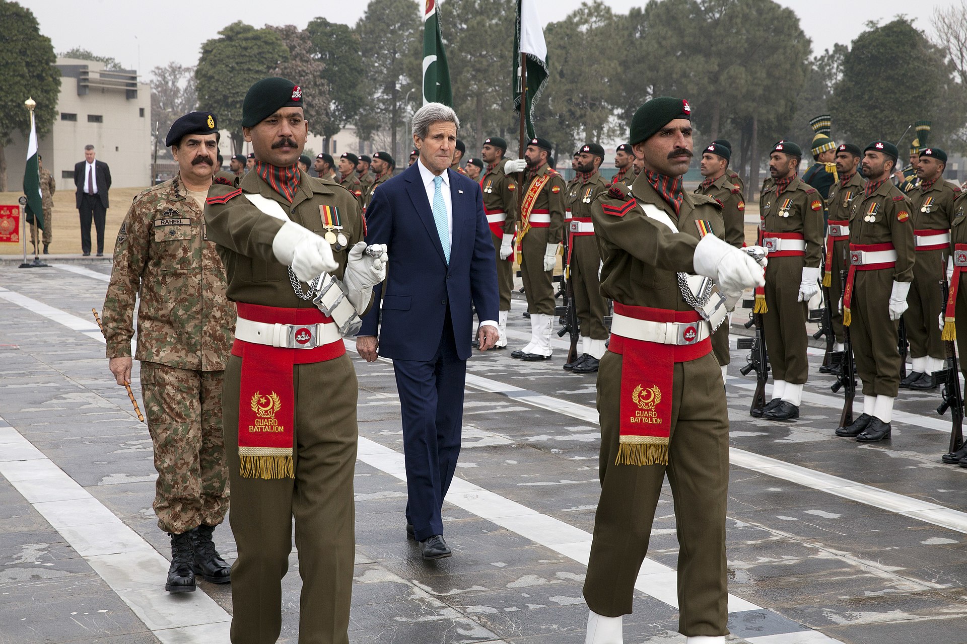 US Secretary of State John Kerry walks with senior Pakistani military officers at GHQ Rawalpindi — the same facility where Pakistan Army chief Asim Munir coordinated the April 2026 Islamabad Talks framework