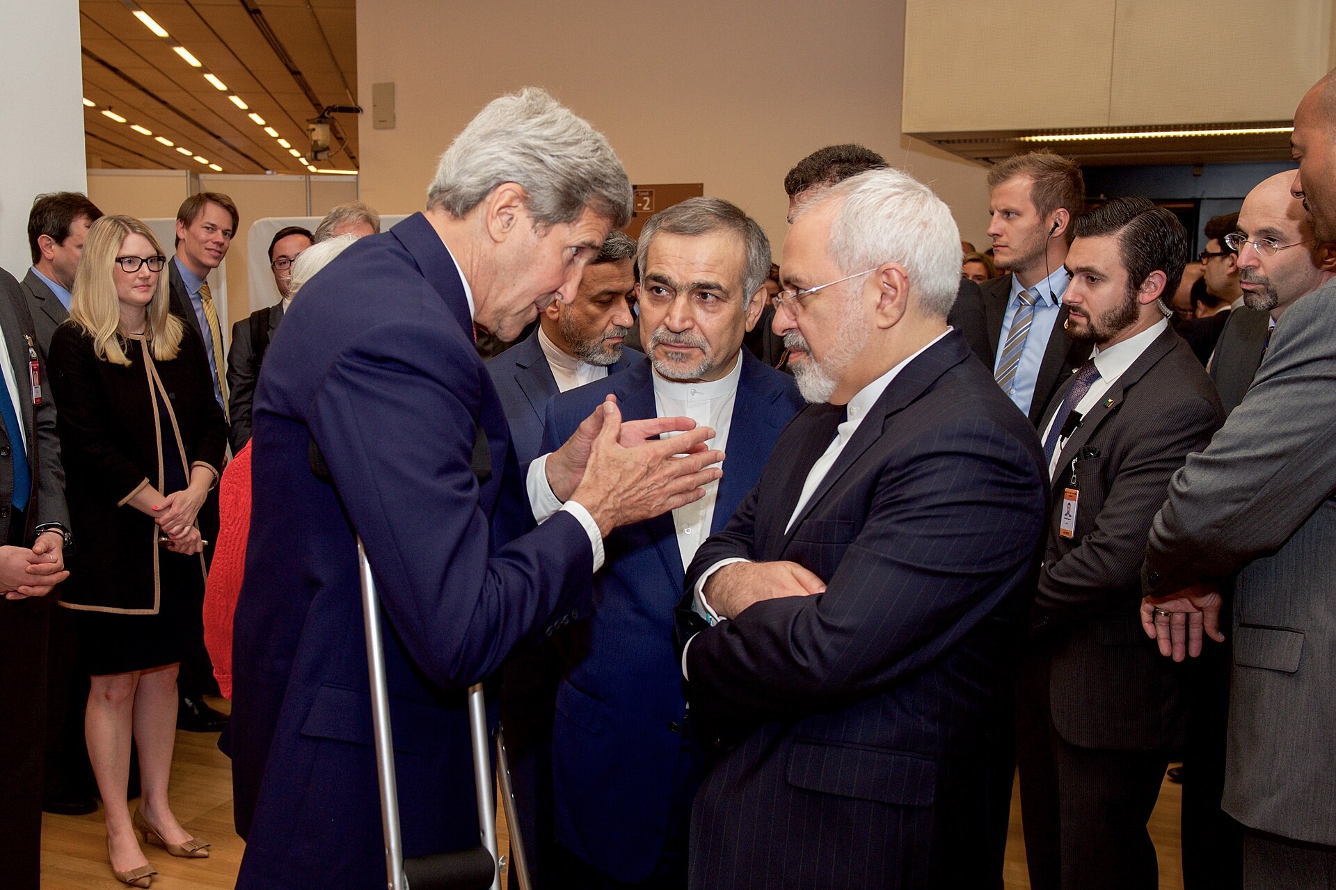 US Secretary of State John Kerry speaks with Iranian Foreign Minister Javad Zarif and Hossein Fereydoun before a press conference during JCPOA negotiations in Vienna, July 2015