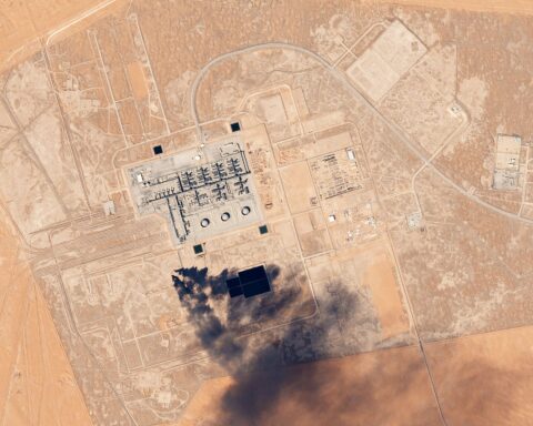 Satellite image of Khurais Oil Processing Facility, Saudi Arabia, showing smoke plume from industrial activity. Planet Labs imagery, February 2017.