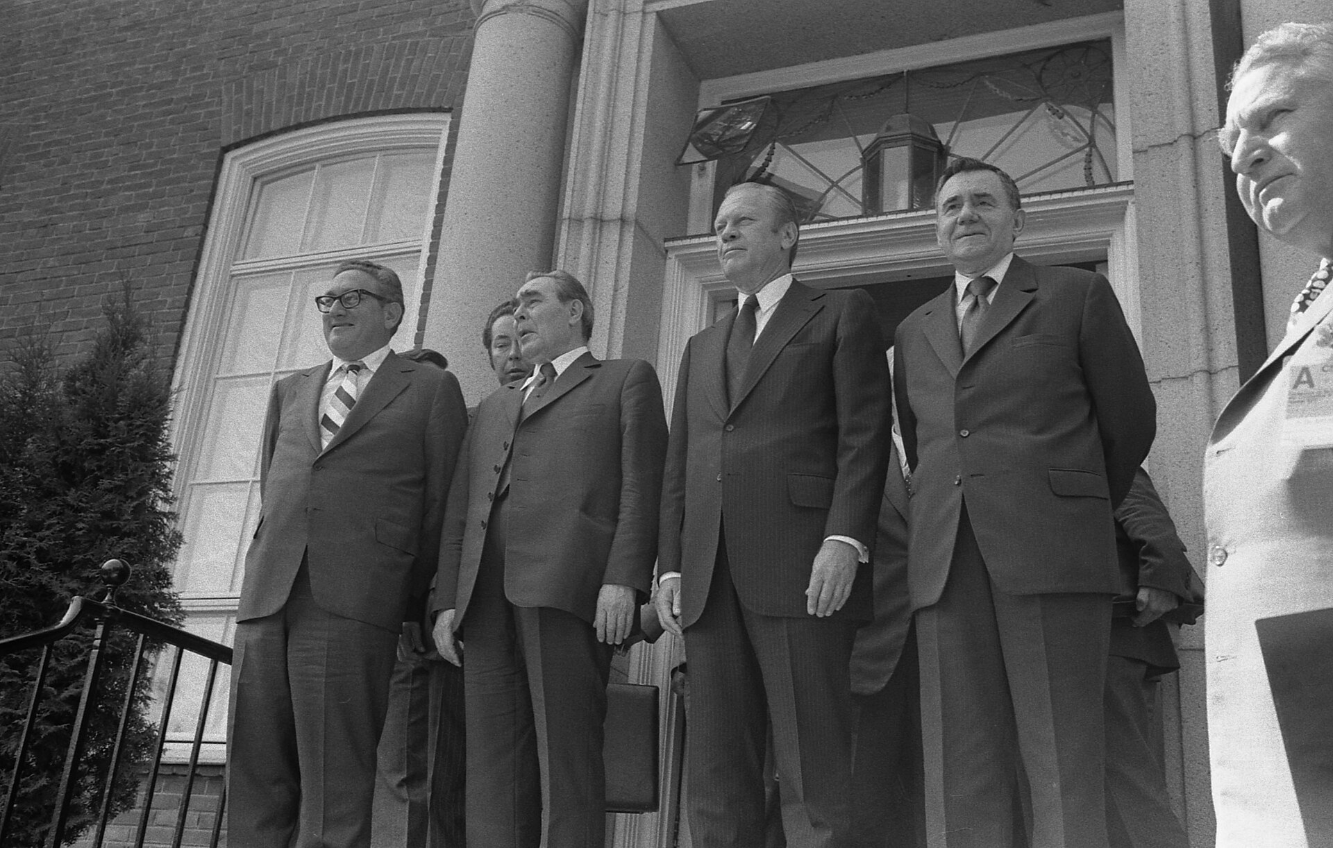 Henry Kissinger, Leonid Brezhnev, Gerald Ford, and Andrei Gromyko on the steps of the US Embassy in Helsinki, August 1975, during the CSCE conference