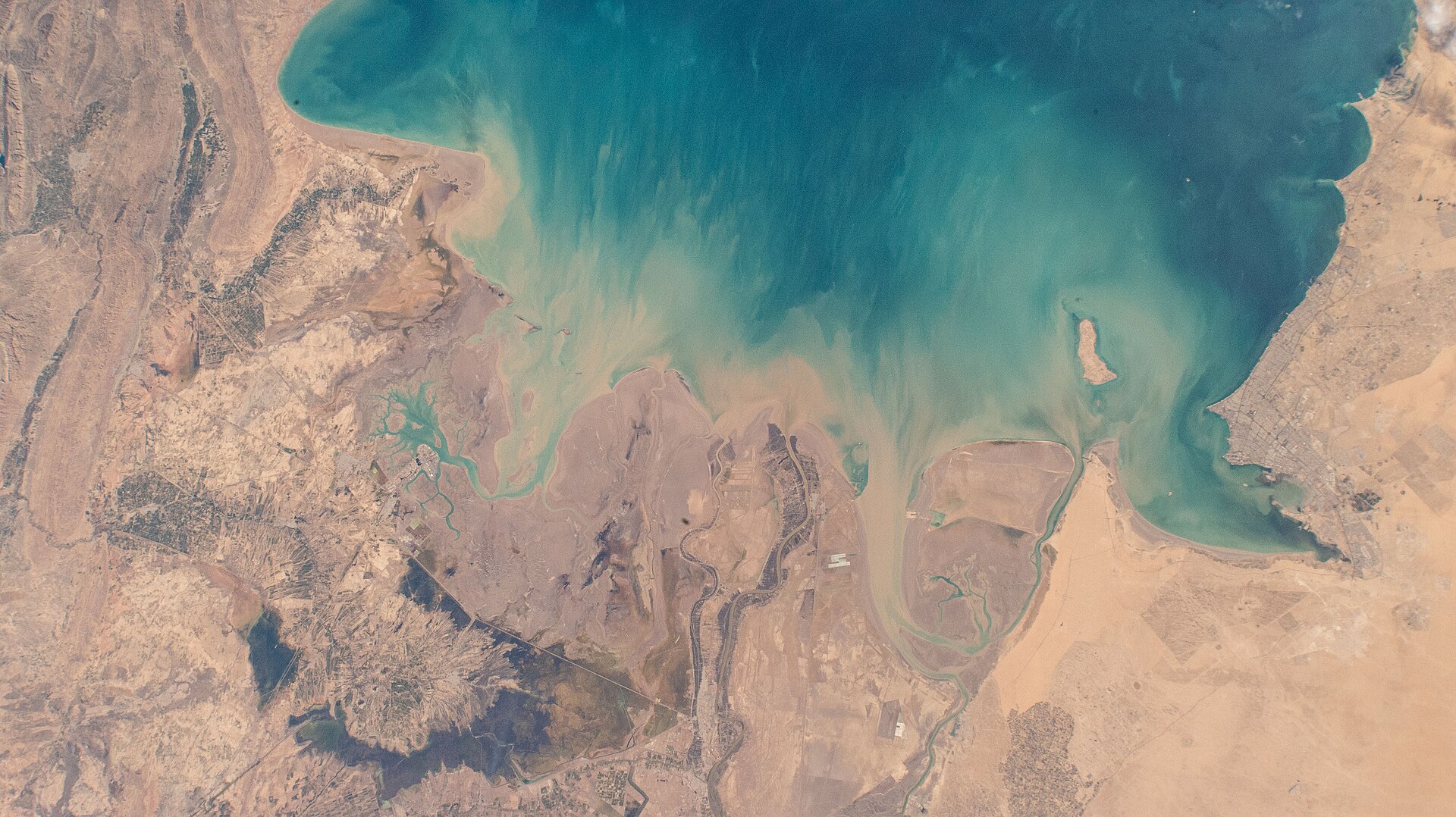 Northern Persian Gulf from the International Space Station — Kuwait, Iraq, and Iran coastlines visible with Bubiyan Island in the upper Gulf at the convergence of all three national territories