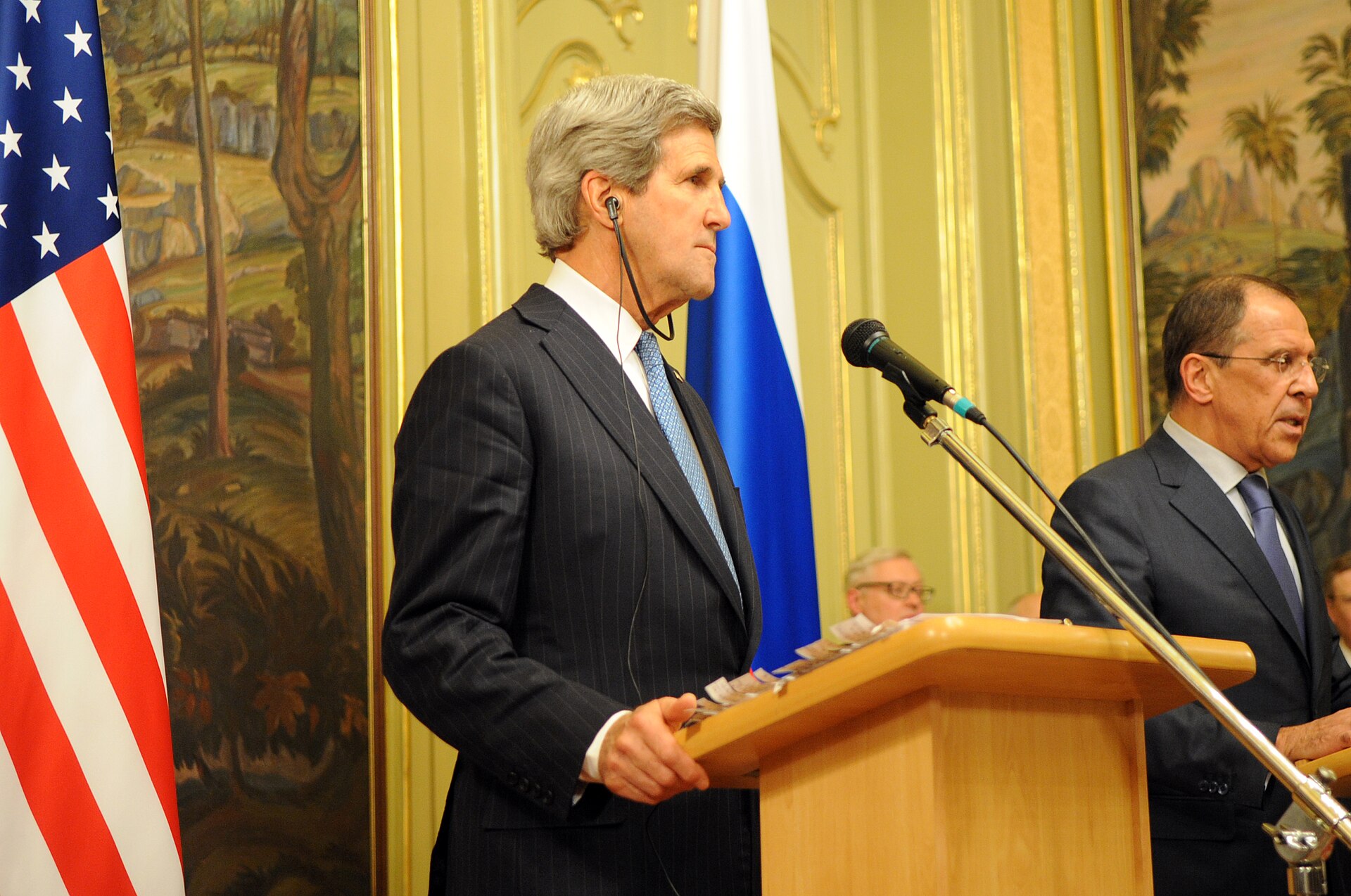 Sergey Lavrov and Secretary Kerry address reporters at the Russian Ministry of Foreign Affairs guesthouse in Moscow, Russian flag in background