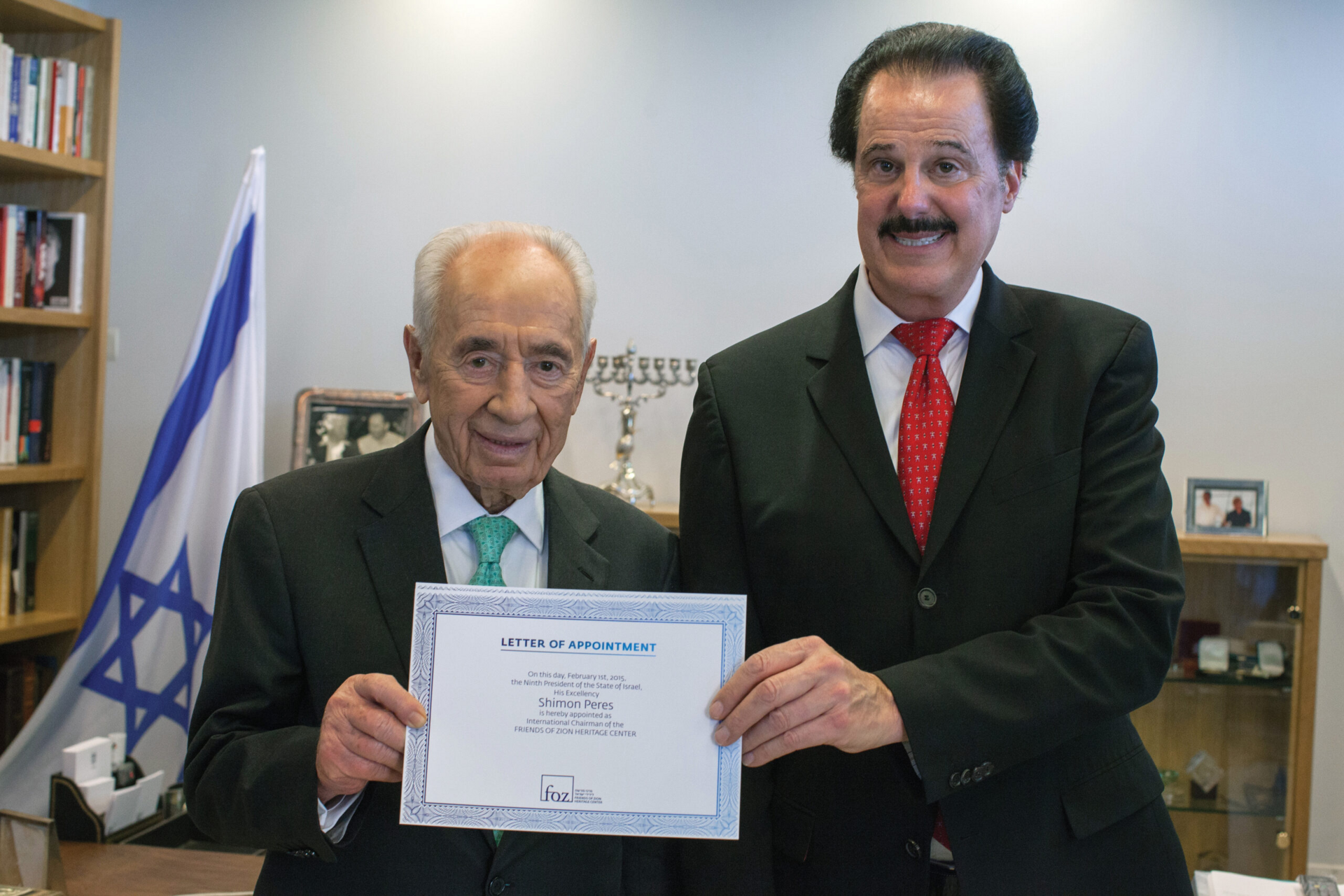 Mike Evans, founder of the Friends of Zion Heritage Center, with former Israeli President Shimon Peres at a FoZ appointment ceremony