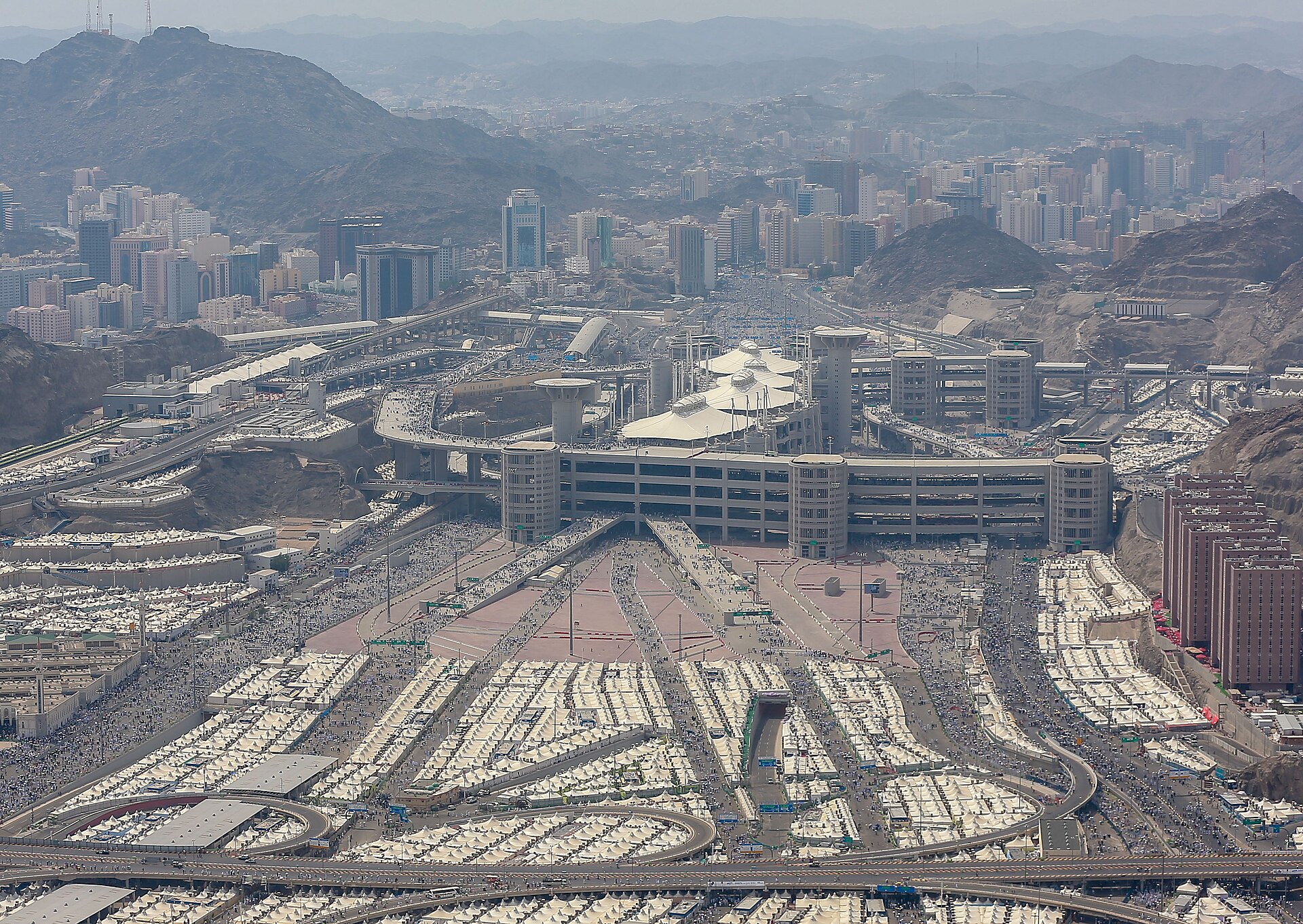Aerial view of Mina valley showing the Jamarat Bridge complex surrounded by the white tent city hosting 1.7 million Hajj pilgrims, Saudi Arabia