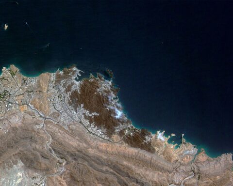 Satellite view of Muscat, Oman — host city for all four rounds of indirect US-Iran nuclear talks in 2026