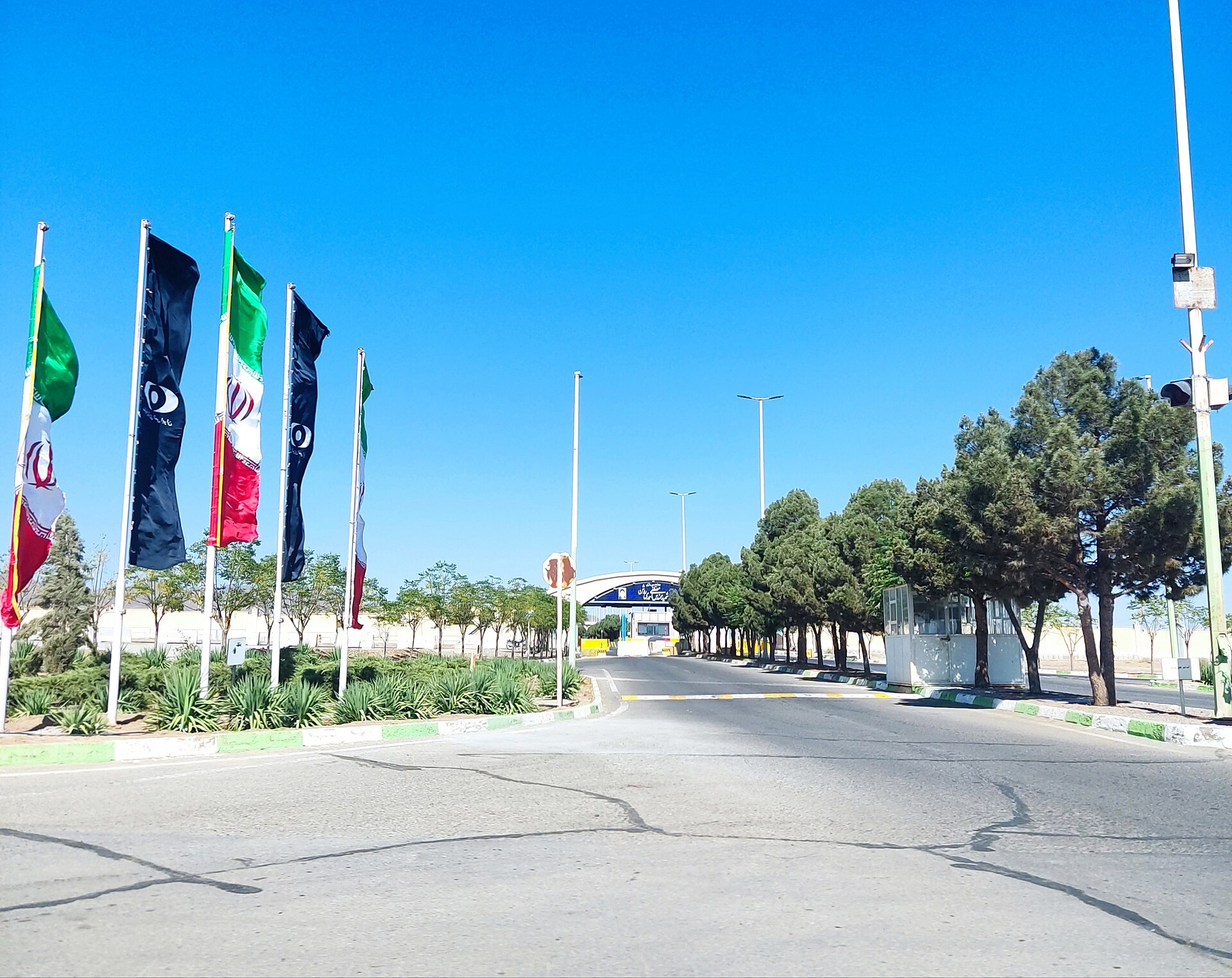Entrance to Iran's Natanz uranium enrichment facility in Isfahan province, showing Iranian and AEOI flags at the site entrance, 2022
