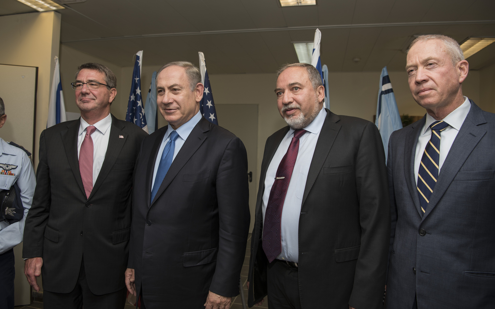 US Secretary of Defense Ash Carter, Israeli Prime Minister Benjamin Netanyahu, and Defense Minister Avigdor Lieberman at the ceremony marking Israel's receipt of its first two F-35 Lightning II jets at Nevatim Air Base, December 12, 2016.