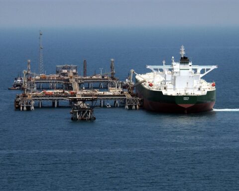 The supertanker AbQaiq approaches an offshore crude oil loading terminal in the Persian Gulf. Named for the key Saudi Aramco oil processing facility, the vessel represents the export infrastructure at the heart of Saudi Arabia revenue model.