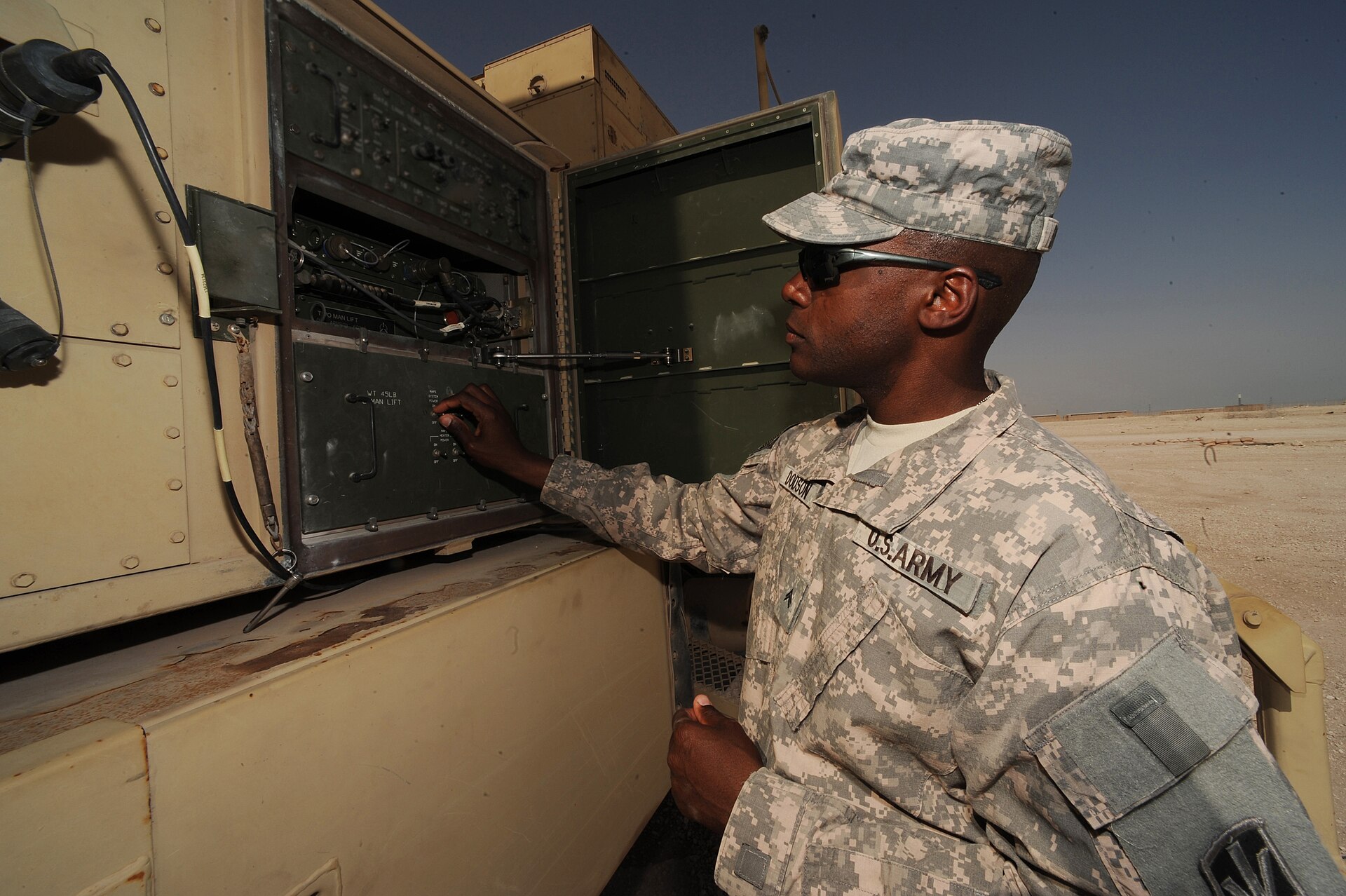 US Army soldier performs maintenance on PAC-3 Patriot missile launch station data link terminal at non-disclosed Southwest Asia location, January 2010