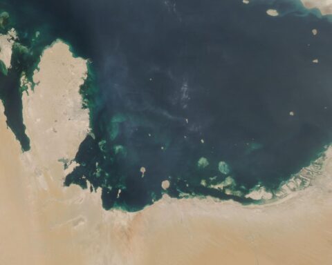 NASA MODIS satellite image of the Persian Gulf showing the Arabian Peninsula coastline and southern Gulf states — UAE, Qatar, and Kuwait visible along the shore — targeted by Iranian drone strikes on May 10, 2026