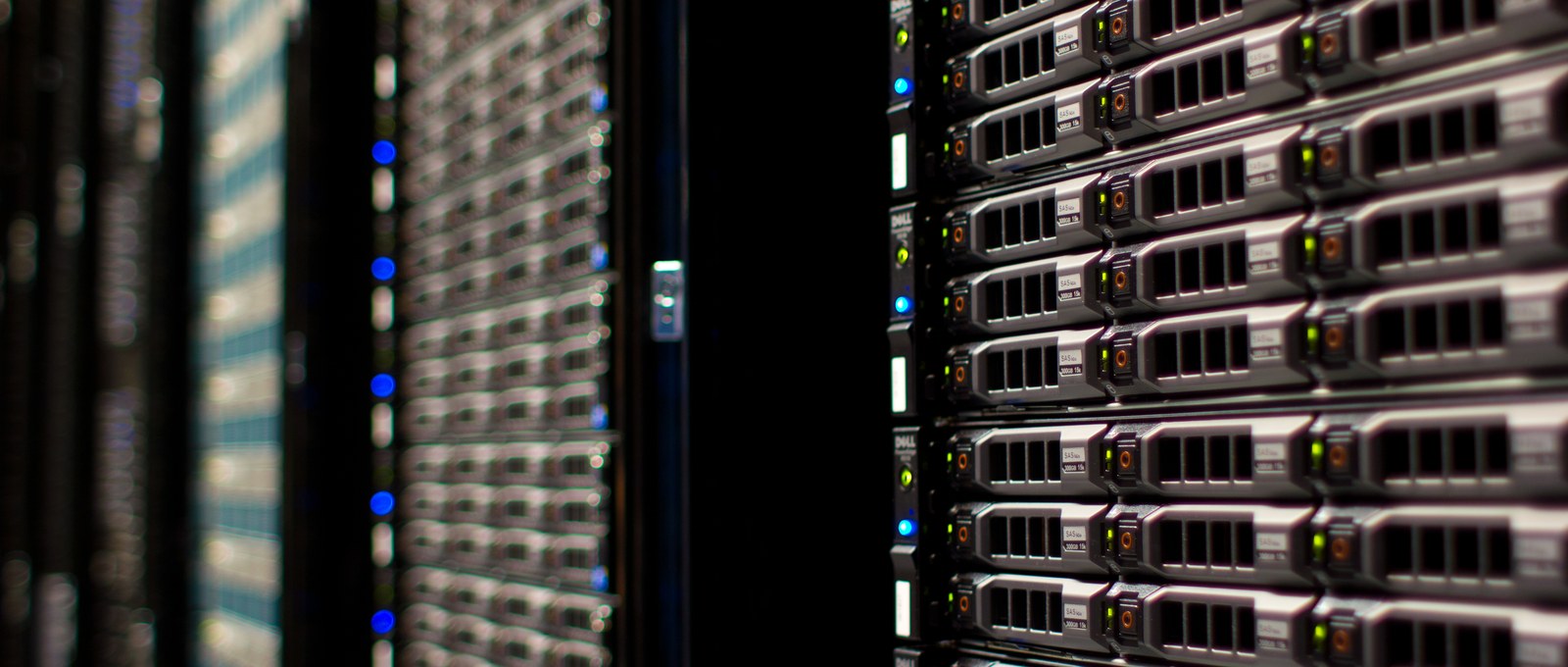 Rows of server racks in a data centre — PIF is pivoting from LIV Golf spectacle to AI infrastructure with HUMAIN