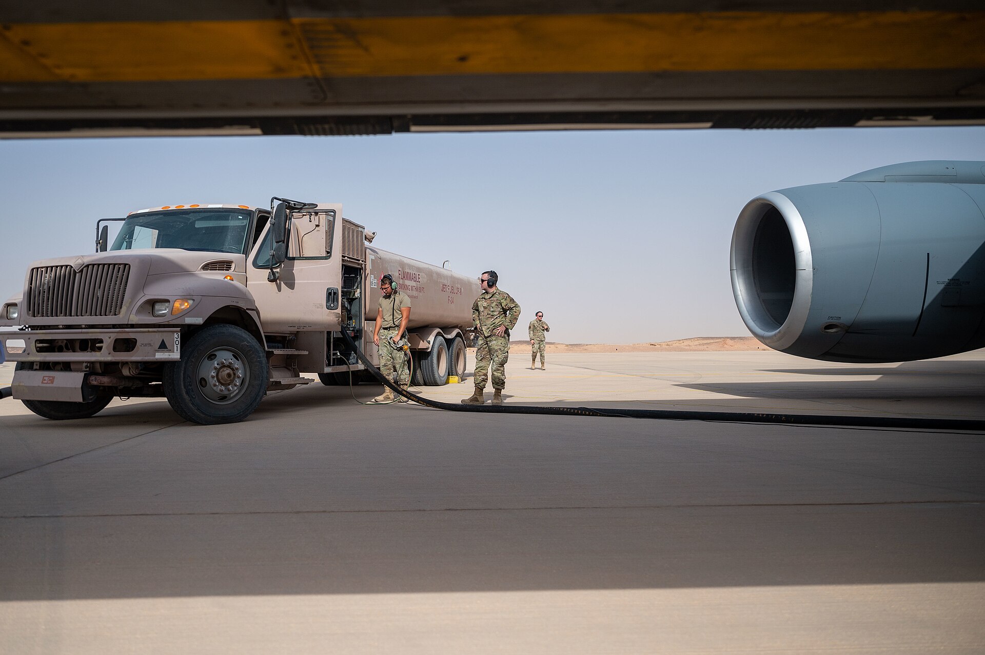 US Air Force airmen refuel a KC-135 Stratotanker on the ramp at Prince Sultan Air Base, Saudi Arabia, during Exercise Agile Phoenix, August 2022