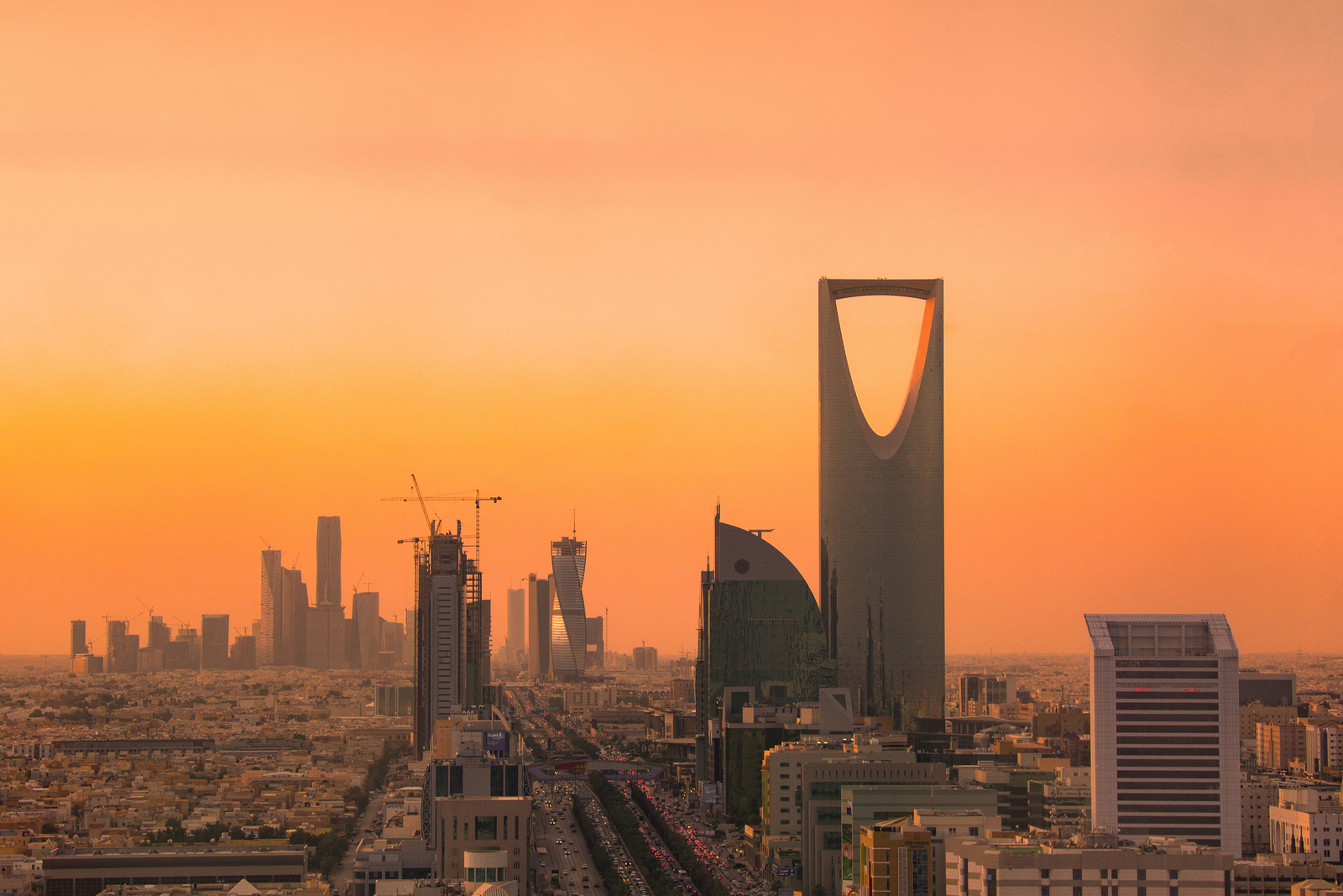 Riyadh skyline at sunset with Kingdom Tower and the King Abdullah Financial District, Saudi Arabia