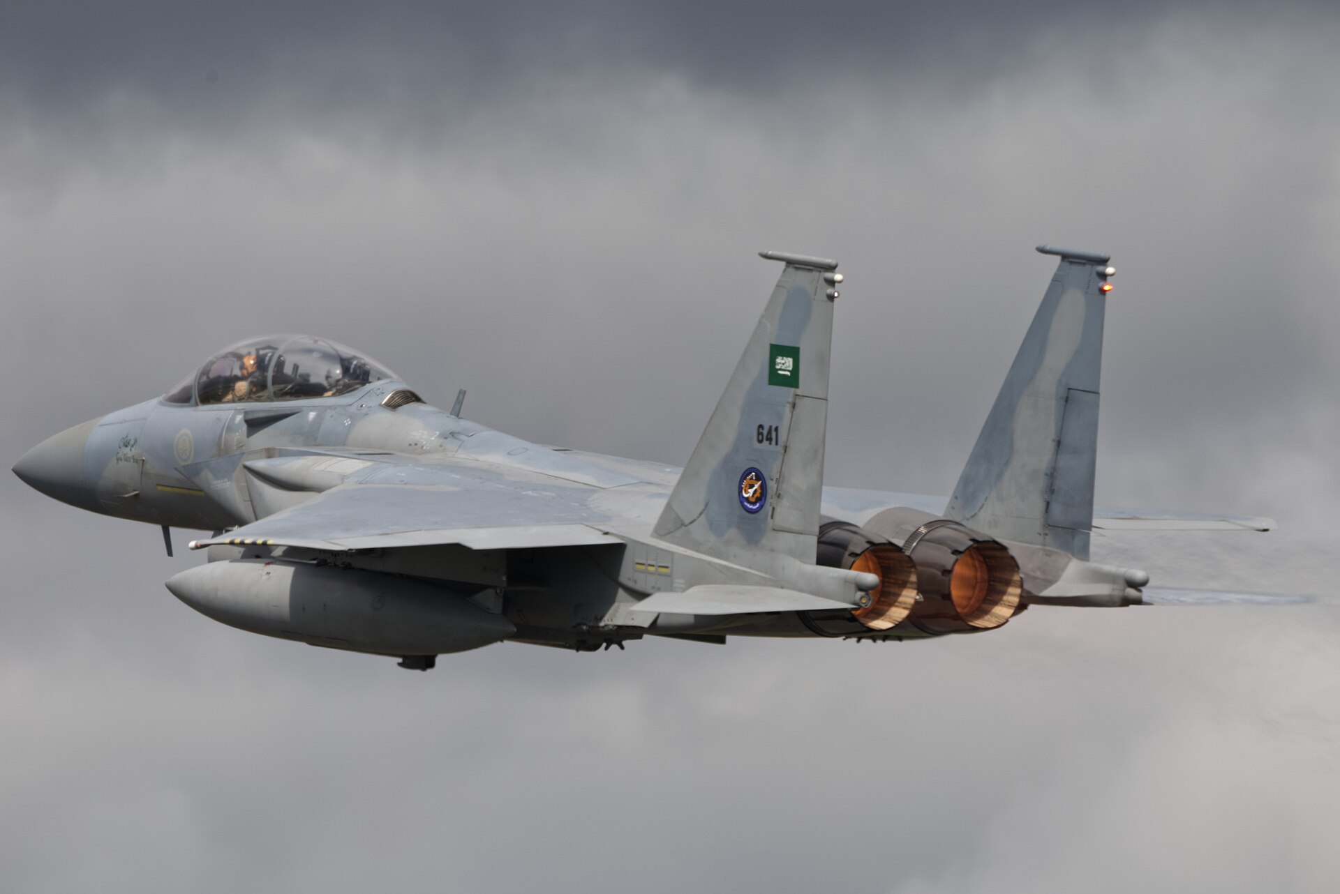 Royal Saudi Air Force F-15SA Strike Eagle in flight with afterburners, Saudi Arabia flag on tail