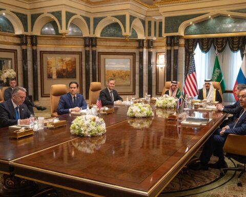 Secretary Rubio meets with Saudi Foreign Minister Faisal bin Farhan and Russian delegation in Riyadh, U.S. and Saudi flags visible on conference table